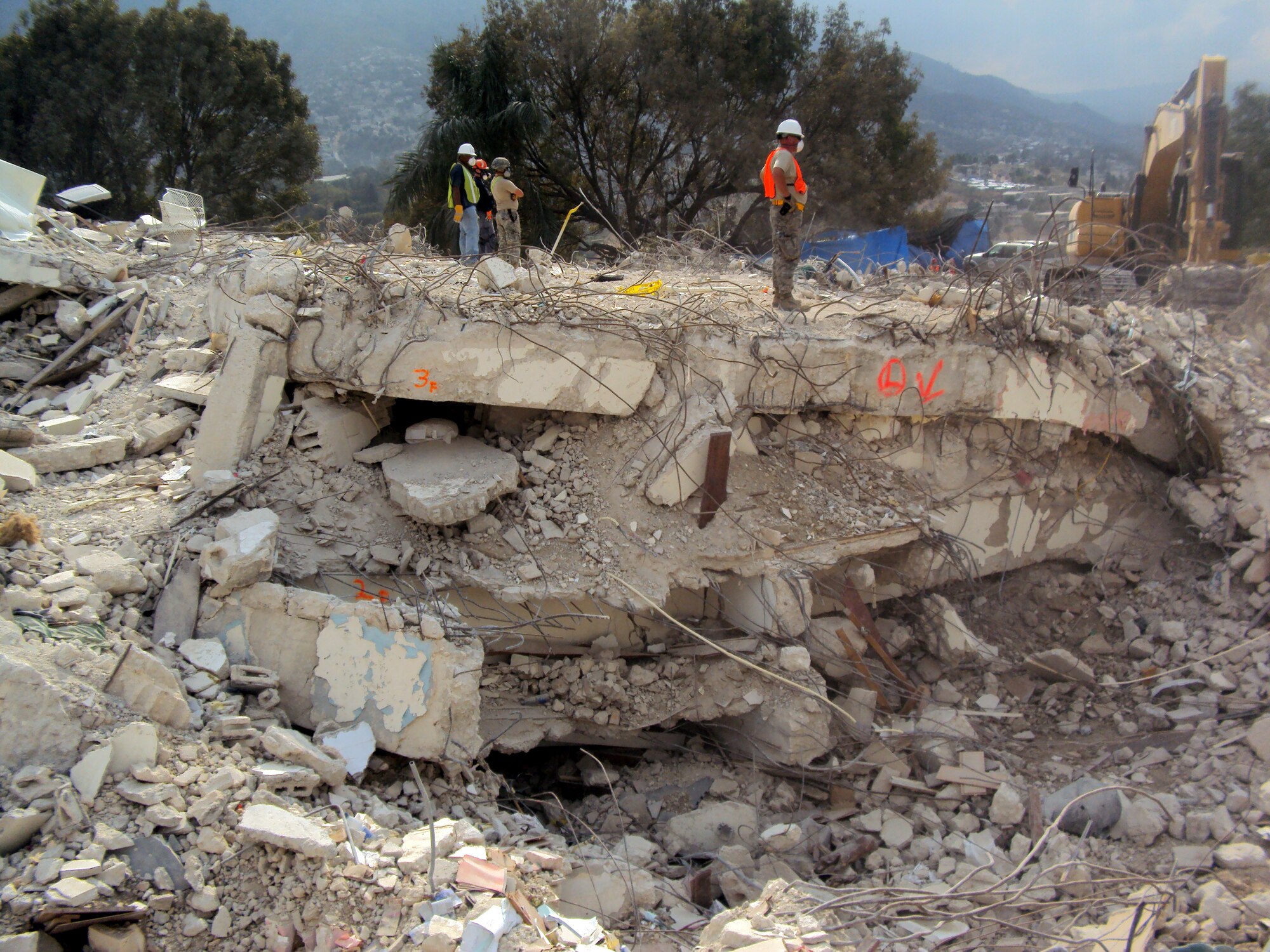 Tech. Sgt. Myles Kvilvang, 67th Aerial Port Squadron, surveys the damaged landscape near Hotel Montana, where he and fellow Citizen Airmen helped the Army recover human remains. (Courtesy photo)