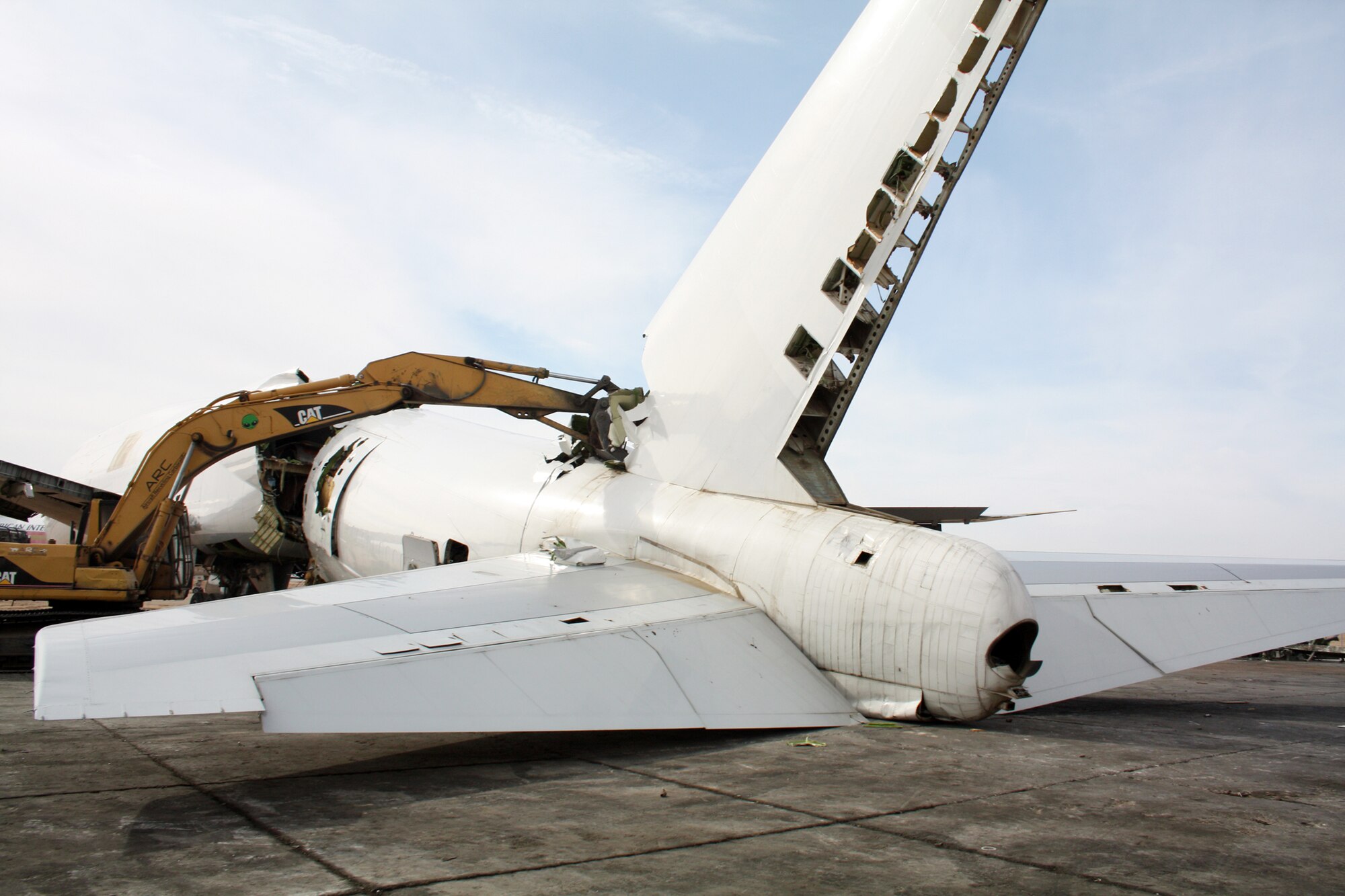 A Boeing 747 cargo plane is disassembled for recycling by workers at the Aircraft Recycling Corporation at the former George Air Force Base in Victorville, Calif.  About 80 to 85 percent of an airplane is recyclable. (Photo courtesy of ARC - Doug Scroggins)