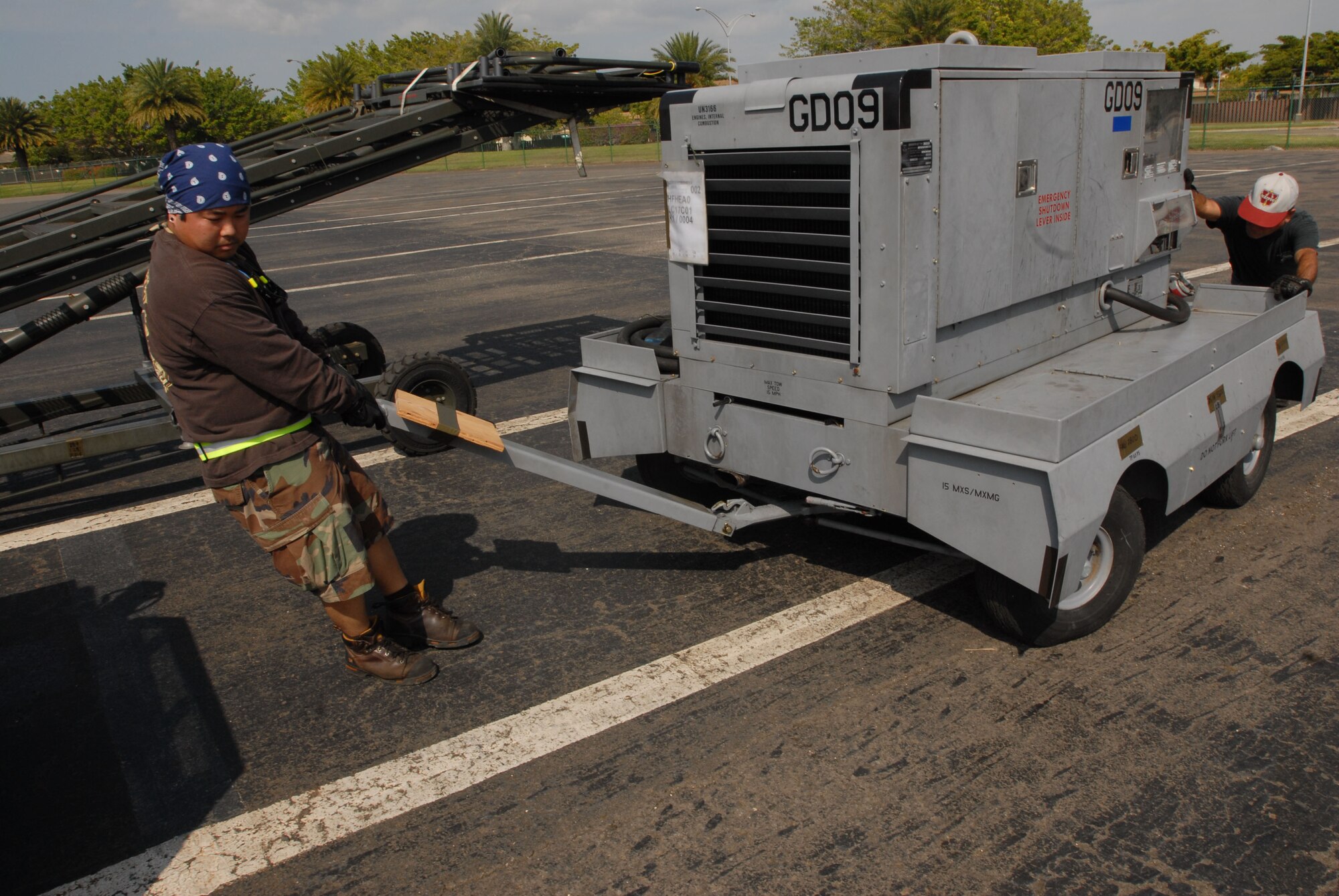 JOINT BASE PEARL HARBOR HICKAM, Hawaii - Garren Lim and Wayne Miyasato, 15th Logistics Readiness Squadron, line cargo up to be taken to Thailand for exercise Cope Tiger here, Feb. 25. Cope Tiger is an annual exercise conducted in Asia-Pacific and includes humanitarioan and civic assistance program. Aviation and ground units from the U.S. Air Force, Republic of Singapore Air Force, and Royal Thai Air Force and Army will participate in the exercise from 1 Mar. through 12 Mar. in Tailand. (U.S. Air Force photo/Senior Airman Gustavo Gonzalez)