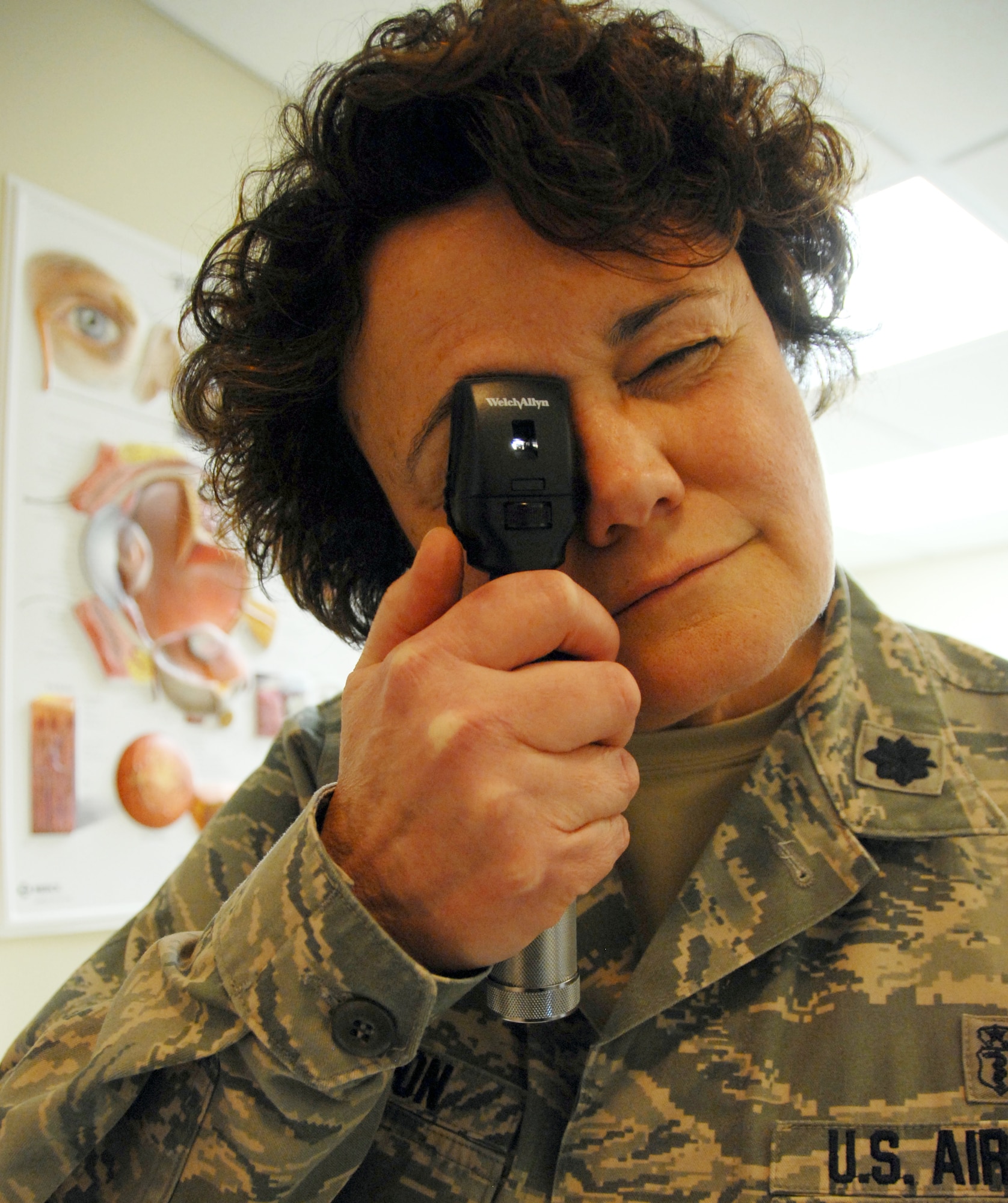 Lt. Col. Annette Williamson, 96th Aerospace Medicine Squadron, looks at a patient’s eyes during a routine exam at the Eglin hospital.  Colonel Williamson, a 15-year veteran, was named optometrist of the year by the Air Force, the Armed Forces Optometric Society and the Association of Military Surgeons.  (U.S. Air Force photo/Airman 1st Class Anthony Jennings.)