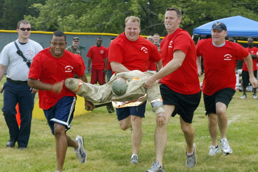 Member of the 700th Airlift Squadron blaze through the Fire Muster competition at Family Day 2009. Family Day 2010 is scheduled for May 1 from 11 a.m. to 4 p.m. at the Lakeside Pavilion.