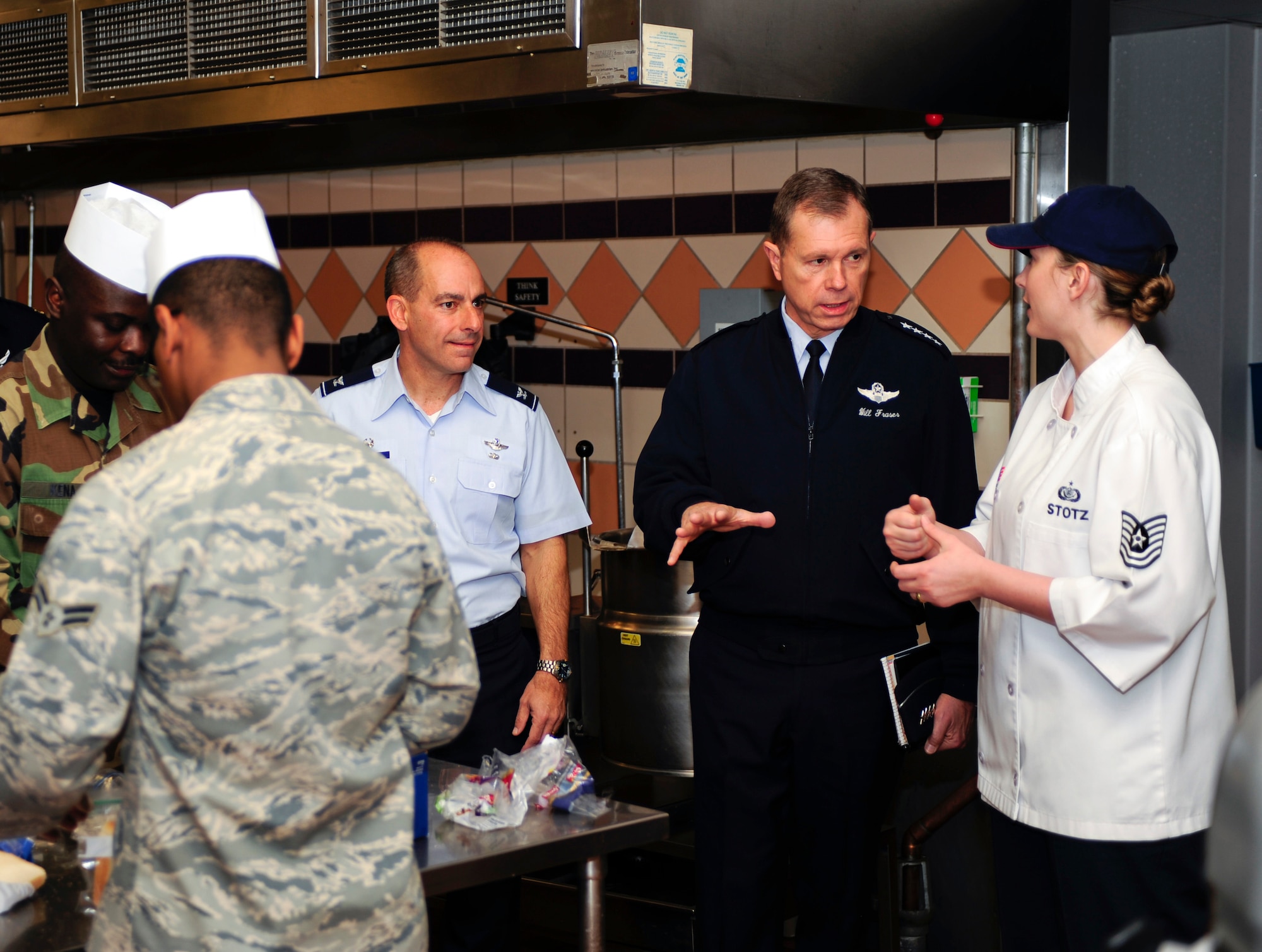 HOLLOMAN AIR FORCE BASE, N.M. -- Gen. William M. Fraser III, Commander, Air Combat Command, receives a description of the kitchen and food preparation area of the Shifting Sands Dining Facility by Tech. Sgt. Joya Stotz, 49th Force Support Squadron, Feb. 22. General Fraser received briefings from many organizations around Holloman during his tour. (U.S. Air Force photo by Senior Airman DeAndre Curtiss)(Released)