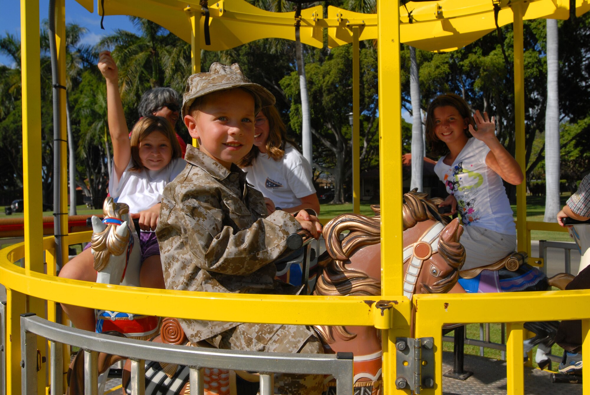 JOINT BASE PEARL HARBOR HICKAM, Hawaii - Joshua Drake, 4, rides the carousel during the Mahalo Fest here, Feb. 26. Mahalo Fest was brought by the 15th Services Squadron marketing team for customer appreciation week. (U.S. Air Force photo/Senior Airman Gustavo Gonzalez)