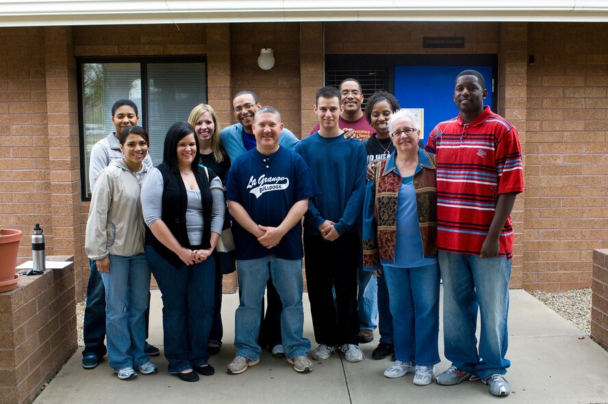 Volunteers from Luke Air Force Base, Ariz., pose for a group photo after their time at the the Childrens Crisis Nursery, Feb 27, 2010. (U.S. Air Force Photo by Staff Sgt. Jason Colbert)