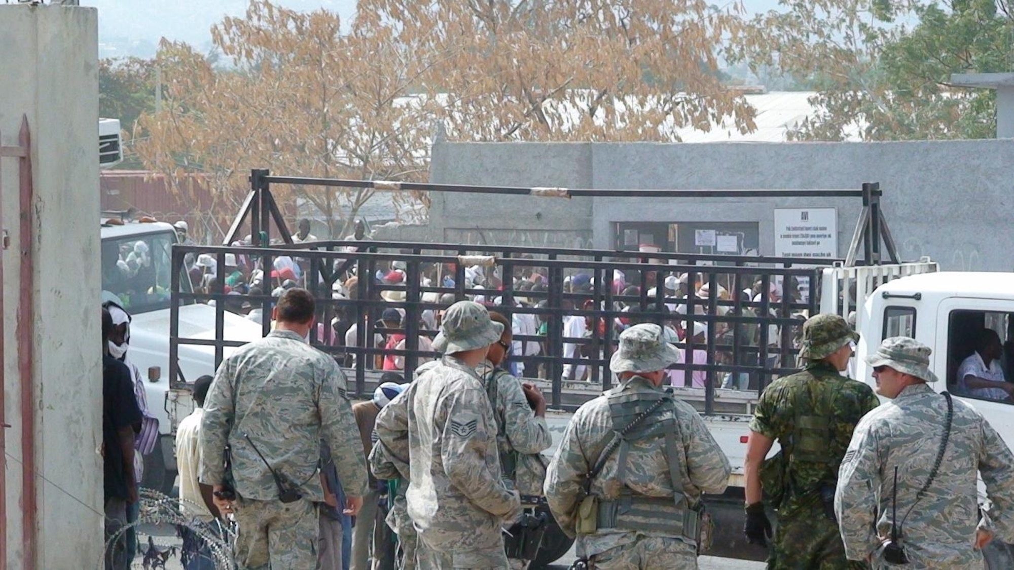 PORT-AU-PRINCE, Haiti -- Airmen from the 823rd Expeditionary Security Forces Squadron provide security at the western gate of the Toussaint L'Ouverture International Airport here. Moody Airmen have been deployed to Haiti to assist with relief operations since January. (Courtesy photo)

