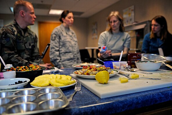 ELLSWORTH AIR FORCE BASE, S.D. -- Various heart-healthy foods are displayed on a counter during while (center-left) Master Sgt. Lori Joyce, 28th Medical Operations Squadron Health and Wellness Center NCO-in charge, briefs about reading nutritional charts to seminar participants, Feb. 26. In order to promote healthy lifestyles, February has been recognized as American Heart Month since 1963. (U.S. Air Force photo/Airman 1st Class Matthew Flynn)