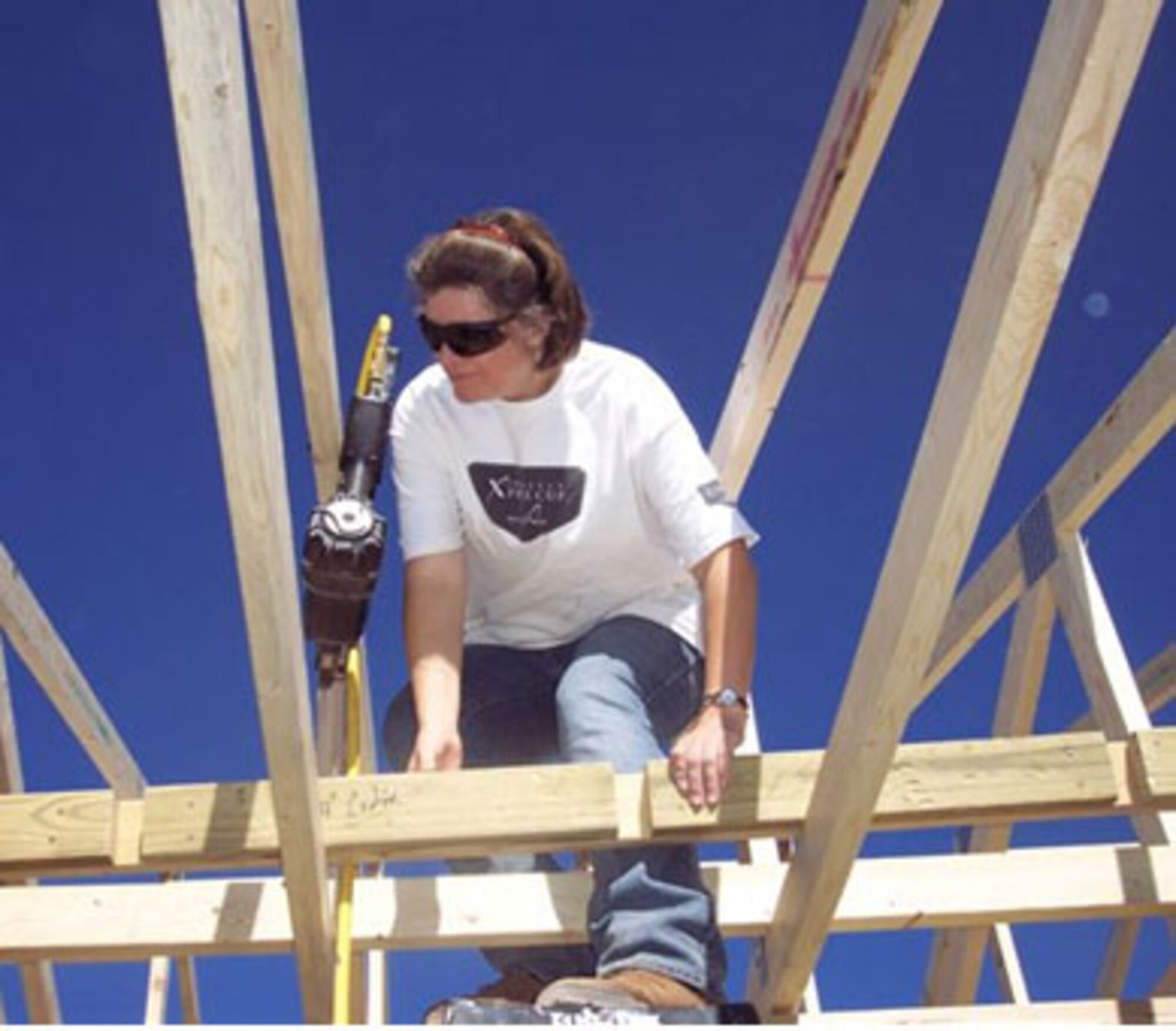 TULAROSA, N.M. -- Master Sgt. Michelle Palmer, 49th Contracting Squadron, helps build a Habitat for Humanity home. Airmen from Holloman Air Force Base, N.M., donated over 500 hours of time to building the home, one of the most energy efficient homes in Otero County. The 49th Civil Engineer Squadron Resource Management Office hopes the experience will inspire Airmen to follow Habitat for Humanity's lead. (Courtesy photo)