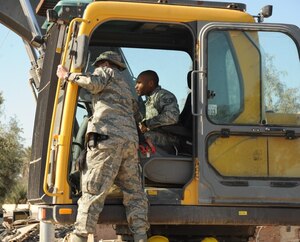 SATHER AIR BASE, Iraq -- Staff Sgt. Azeez Oguntade, Headquarters Air Combat Command Protocol, operates machinery in Iraq. Sergeant Oguntade said he gets the opportunity to learn different jobs Airmen do while deployed. (Courtesy photo)