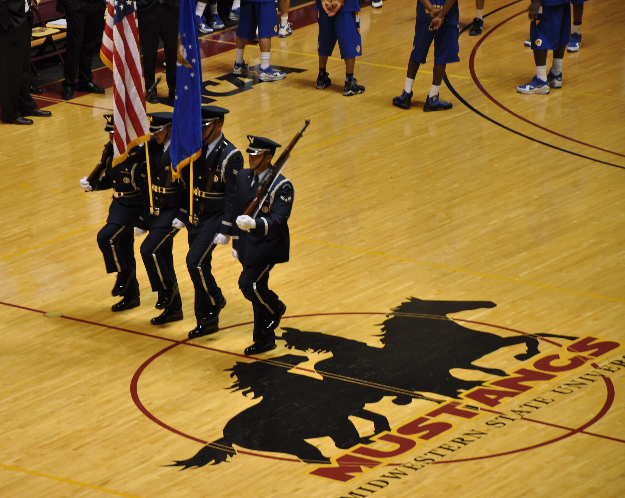 Sheppard Honor Guard presents the colors at the Midwestern State University Women's Basketball Team during Military Night Feb 24. Base participation also included 82nd Training Wing Vice Commander Col. Michael Hake accepting a game ball and Airmen receiving a warm welcome from the MSU Women?s Basketball Team. Sheppard spirit was high during the Lone Star Conference Final as the Women's MSU team won 69-67 and the MSU Men's team overtook the Angelo State Rams with a final score of 105-100. (U.S. Air Force photo/Debi Smith)