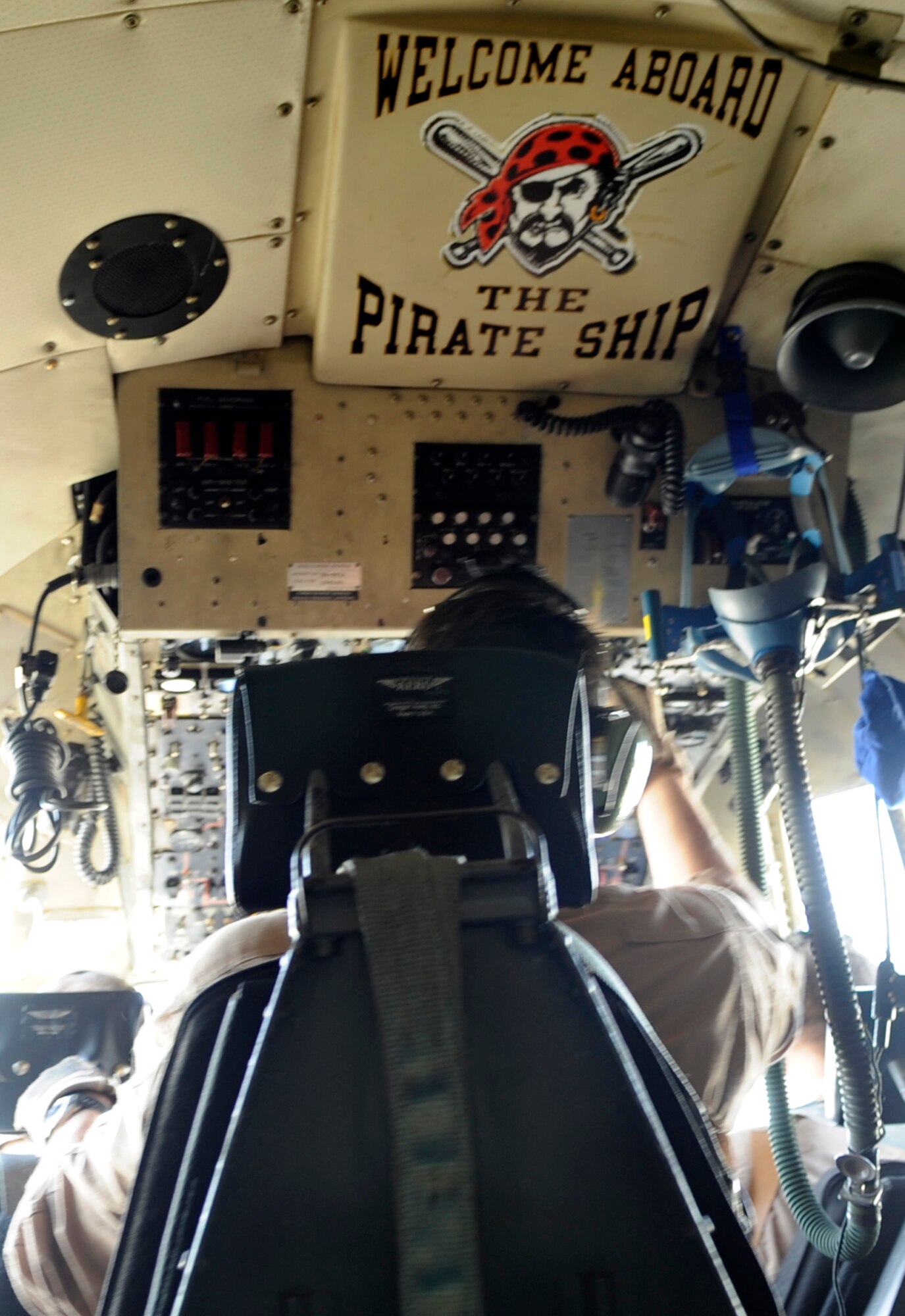 A deployed Air Force Reserve C-130H from the 911th Airlift Wing, Pittsburgh Air Reserve Station, Pa. welcomes combat passengers aboard with colorful Pirate ship displays to include this sign on the flight deck and hand-painted mural displaying the Pittsburgh Pirates' upon its nose. The aircraft displays its Pittsburgh Spirit as it flies combat missions throughout Southwest Asia waving a yellow tail-banner with the words Pittsburgh scrawled in black. It's mission is to perform inter-theater airlift in support of Operations Enduring and Iraqi Freedom. Team Pittsburgh consists of multiple aircrew, aircraft, as well as numerous maintenance and support personnel. While their friends and family back home battle record snowfall, the crew attached to the 379th Air Expeditionary Wing at undisclosed base in Southwest Asia, supports the ground battle in Marjah, Afghanistan, and elsewhere by delivering vital assets, ground equipment and personnel - anything and everything needed to support the ground war. (U.S. Air Force Photo/Capt. Cathleen Snow)