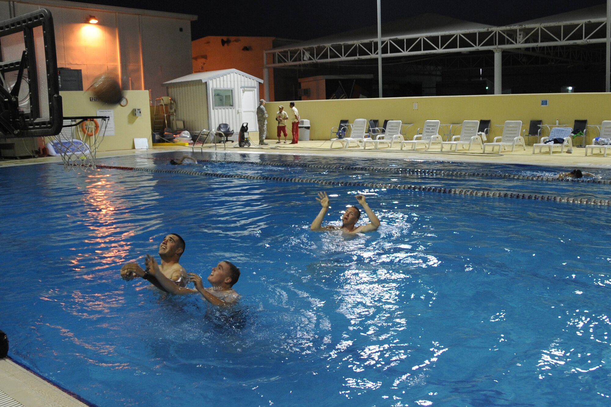Members of the 380th Air Expeditionary Wing utililize the newly renovated pool at an undisclosed location in Southwest Asia Feb. 26, 2010.  The pool was closed for a month so that repairs could be made before tempertures rose. (U.S. Air Force Photo/Senior Airman Jenifer H. Calhoun/Released)
