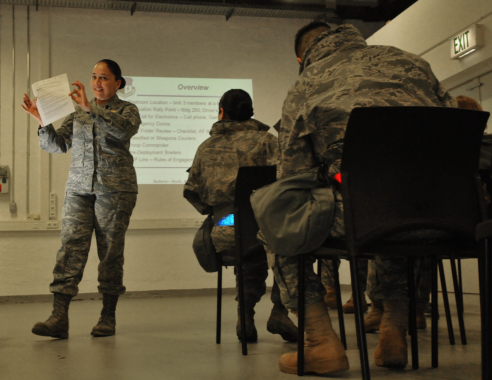 SPANGDAHLEM AIR BASE, Germany – Tech. Sgt. Bonny Reyes, 52nd Force Support Squadron force management superintendent, briefs deployers on events for processing through a simulated personnel deployment function line during a Phase I operational readiness exercise Feb. 25. The PDF line is part of the pre-deployment checklist Airmen must go through to ensure they have all the proper documentation, medical clearances and requirements to deploy. (U.S. Air Force photo/Airman 1st Class Nick Wilson)