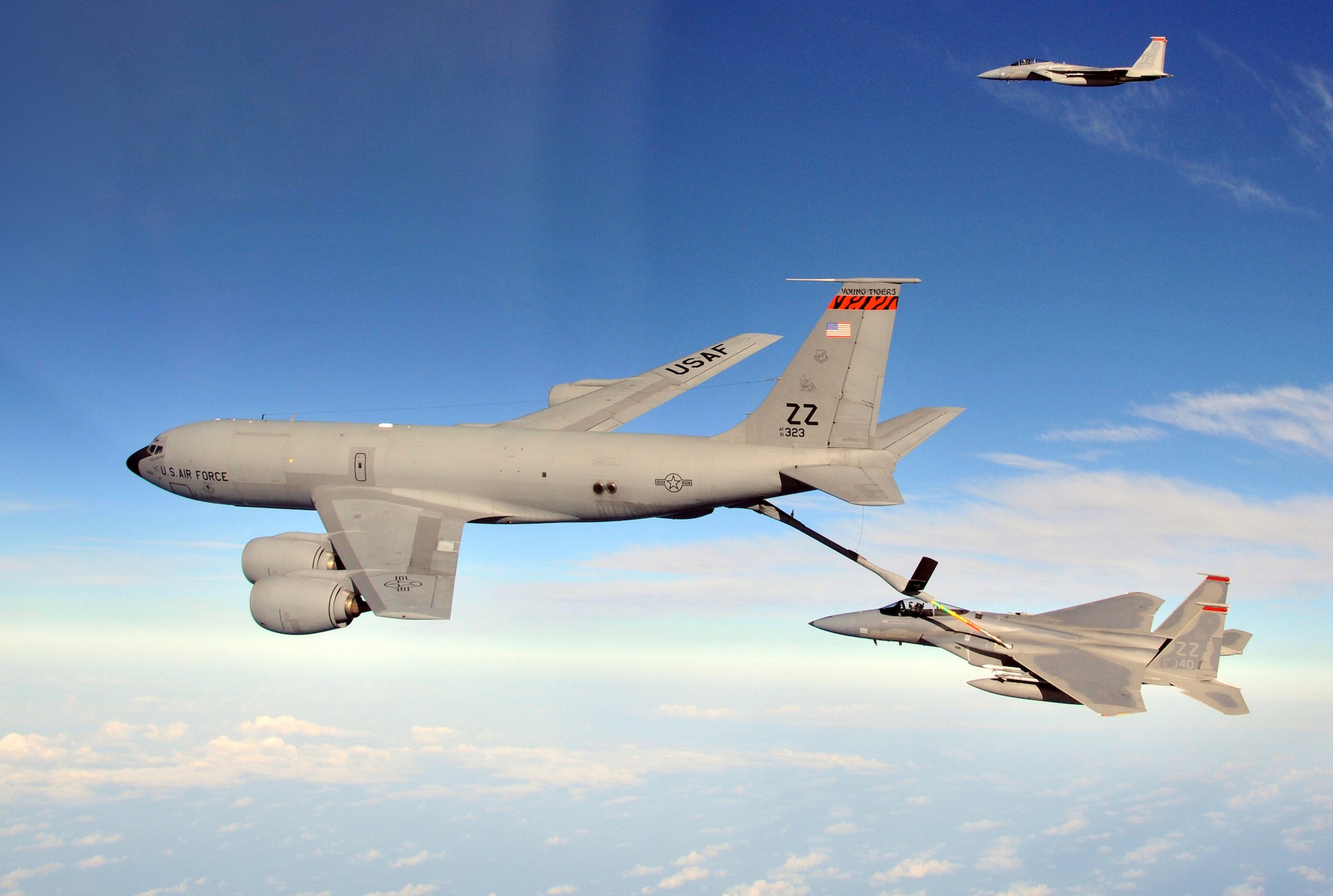 F-15 Eagles from the 67th Fighter Squadron are refueled by a KC-135 Stratotanker from the 909th Air Refueling Squadron during joint bilateral training with units from other bases around the Pacific, near Kadena Air Base Feb 25. (U.S. Air Force photo / Tech. Sgt. Angelique Perez)