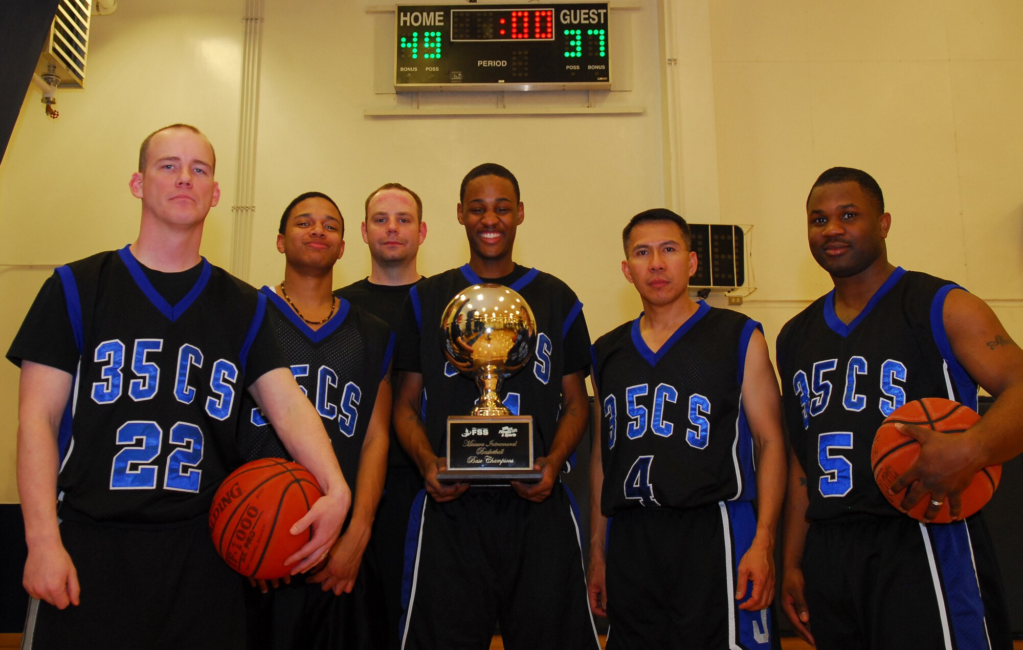 MISAWA AIR BASE, Japan – Left to right, Tech. Sgt. Fred Statton, Airman 1st Class Krystofer Benson, Tech. Sgt.  Eric Wentworth, Airman Bryan Kennerly, Senior Master Sgt. Dela Cruz and Senior Airman Darvin Johnson (not pictured) Darone Frierson, Airman 1st Class Justin Hampton, Tech Sgt. Carlos Cervantes and Staff Sgt. Ian Ventura represented the 35th Communications Squadron during an intramural basketball tournament Feb. 11 at the Potter Fitness Center. The 35th Comm. beat the 35th Force Support Squadron 49-37 in overtime. (U.S. Air Force photo/Staff Sgt. Phillip Butterfield)