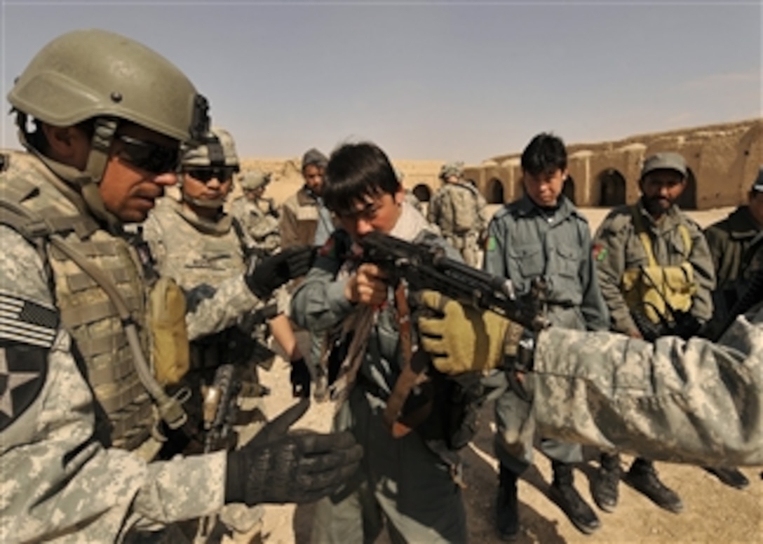 Afghan National Police officers attend a marksmanship training course led by U.S. Army soldiers from 2nd Battalion, 1st Infantry Regiment in Hutal, Afghanistan, on Feb. 14, 2010.  