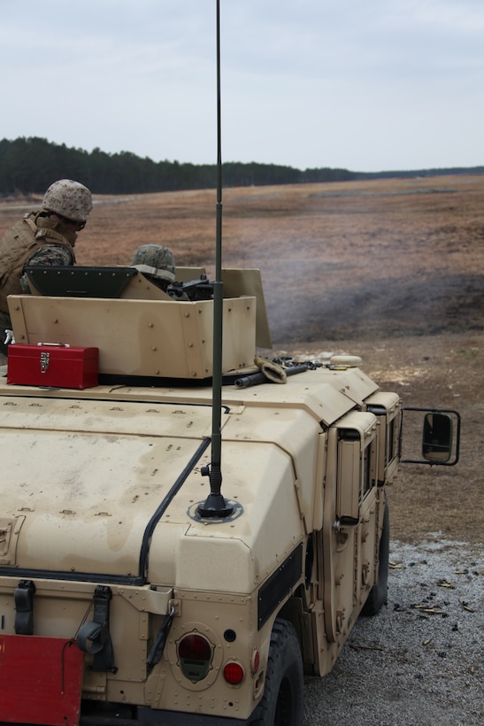 A Marine Wing Support Squadron 271 Marine instructs his subordinate on firing the M-2 .50-caliber heavy machine gun at Marine Corps Base Camp Lejeune, March 2. The Marines fired the M-2 from a mounted position on top of a humvee to increase their familiarity of crew-served weapons systems.