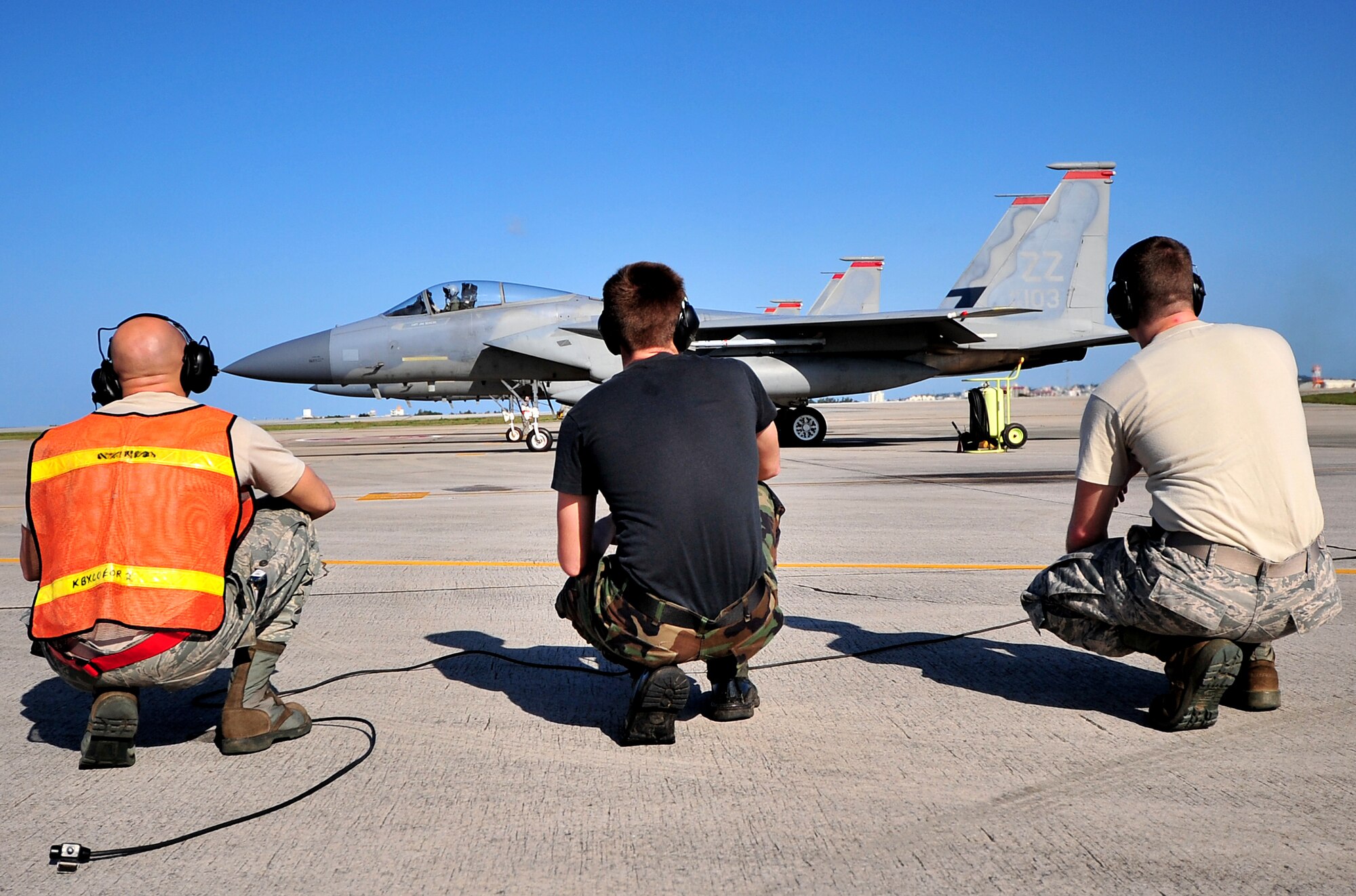 Airmen from the 67th Fighter Squadron stay clear of the aircraft before take-off Feb. 23. Kadena Airmen participated in joint bilateral training with other U.S. forces and the Japan Air Self Defense Force from Feb. 22-26.The training involved joint planning and the execution of missions in simulated hostile scenarios in development of theater security. (U.S. Air Force photo/Tech. Sgt. Rey Ramon) 
           
                                      
                                                    