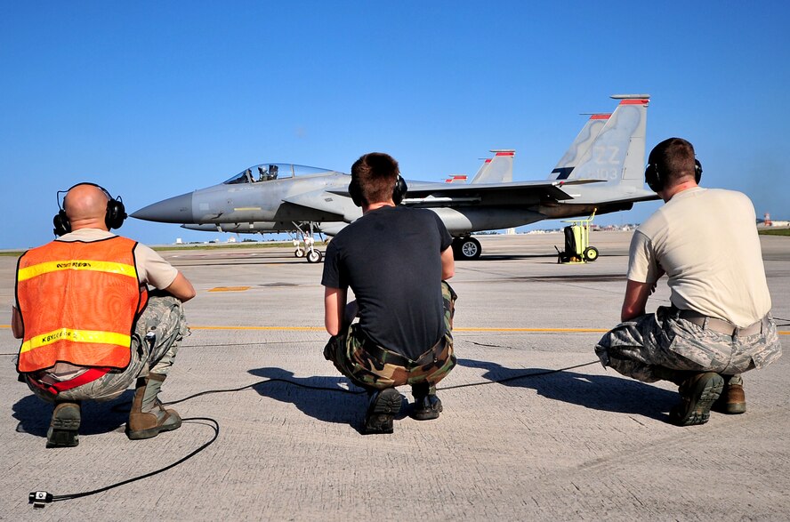 Airmen from the 67th Fighter Squadron stay clear of the aircraft before take-off Feb. 23. Kadena Airmen participated in joint bilateral training with other U.S. forces and the Japan Air Self Defense Force from Feb. 22-26.The training involved joint planning and the execution of missions in simulated hostile scenarios in development of theater security. (U.S. Air Force photo/Tech. Sgt. Rey Ramon) 
           
                                      
                                                    