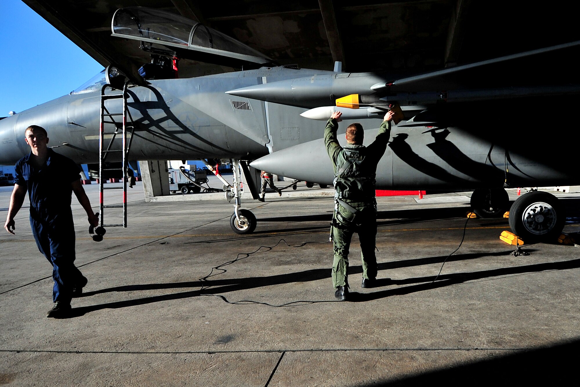 A pilot from the 44th Fighter Squadron makes his rounds around the aircraft before heading to the end of runway for take-off Feb. 23. Kadena Airmen participated in joint bilateral training with other U.S. forces and the Japan Air Self Defense Force from Feb. 22-26.The training involved joint planning and the execution of missions in simulated hostile scenarios in development of theater security. (U.S. Air Force photo/Tech. Sgt. Rey Ramon)  
           
                                      
                                                    
