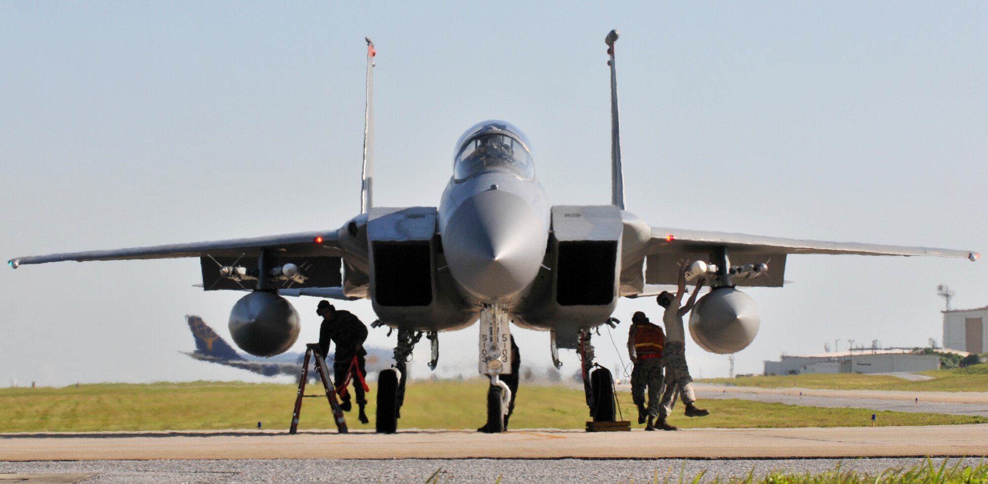 A small group of Airmen from the 67th Aircraft Maintenance Unit ensure F-15 Eagles get one final checkup at the end of runway before take-off Feb. 23. Kadena Airmen participated in joint bilateral training with other U.S. forces and the Japan Air Self Defense Force from Feb. 22-26.The training involved joint planning and the execution of missions in simulated hostile scenarios in development of theater. (U.S. Air Force photo/Tech. Sgt. Rey Ramon)  
           
                                      
                                                    