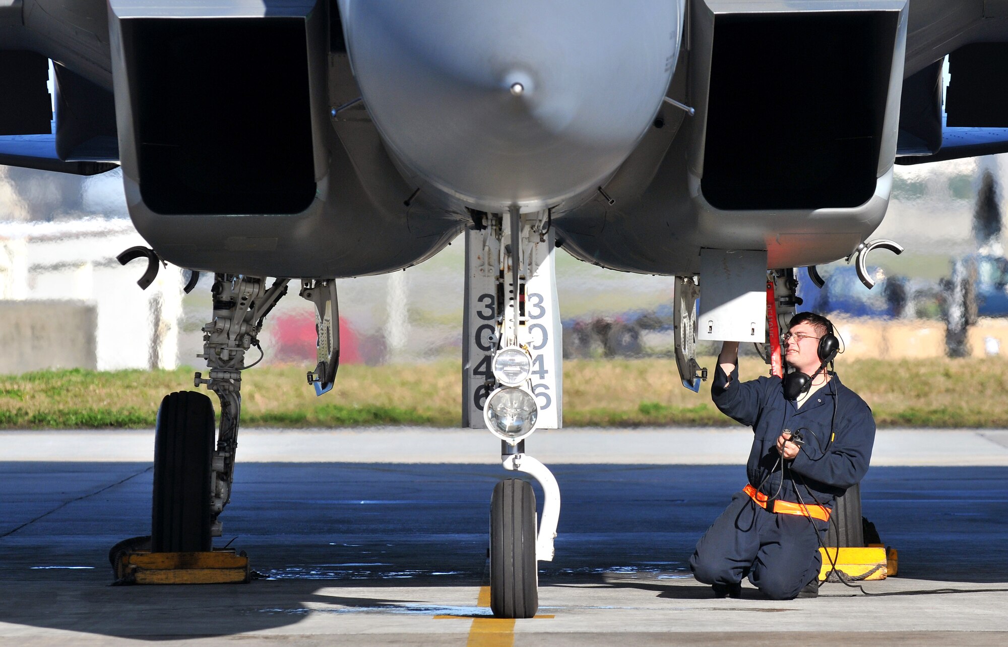 An Airman from the 44th Aircraft Maintenance Unit conducts pre-flight checks on an F-15C Eagle Feb. 23. Kadena Airmen participated in joint bilateral training with other U.S. forces and the Japan Air Self Defense Force from Feb. 22-26.The training involved joint planning and the execution of missions in simulated hostile scenarios in development of theater .(U.S. Air Force photo/Tech. Sgt. Rey Ramon)                   
                                      
                                                    