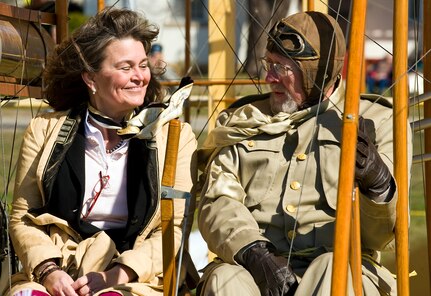 Amanda Wright Lane, great grandniece of the Wright Brothers, takes a ride with Don Gum down the Fort Sam Houston Parade Ground in San Antonio March 2, 2010, during the Foulois Centennial Military Flight Celebration event. Mr. Gum is a Wright "B" Flyer pilot. (U.S. Air Force photo/Staff Sgt. Bennie J. Davis III) 