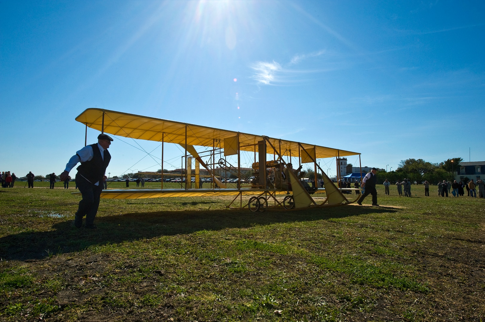 Don Gum, a Wright "B" Flyer pilot, taxis the "Yellow Bird" down the Fort Sam Houston parade ground March 2, 2010, during the Foulois Centennial Military Flight Celebration at Fort Sam Houston, Texas. (U.S. Air Force photo/Staff Sgt. Bennie J. Davis III) 