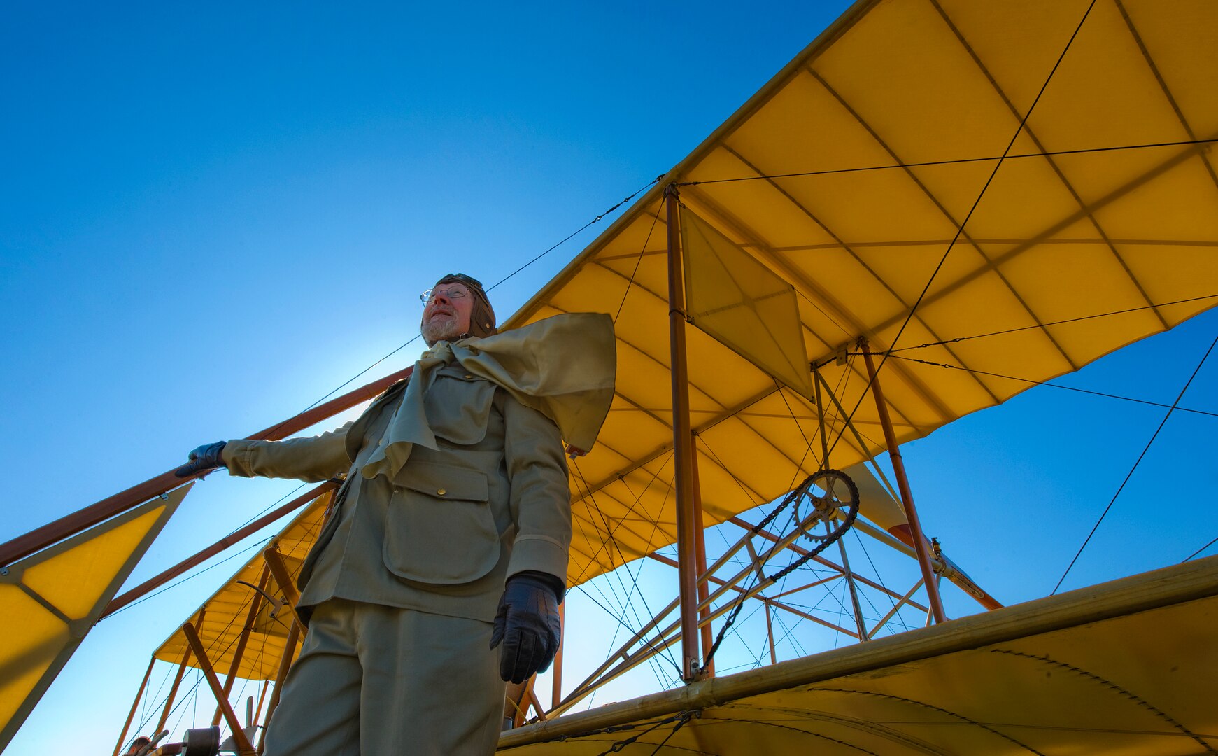 Don Gum, pilot of this Wright "B" Flyer, stands before the aircraft before taxiing down the Fort Sam Houston parade ground during the Foulois Centennial Military Flight Celebration March 2, 2010, at Fort Sam Houston, Texas. (U.S. Air Force photo/Staff Sgt. Bennie J. Davis III)