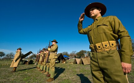 Members of the Texas Military Forces Museum, who are dressed in replica Army uniforms of 1910, render a salute during the opening ceremonies of the Fort Sam Houston Foulois Centennial Military Flight Celebration March 2, 2010 at Fort Sam Houston, Texas. (U.S. Air Force photo/Staff Sgt. Bennie J. Davis III) 