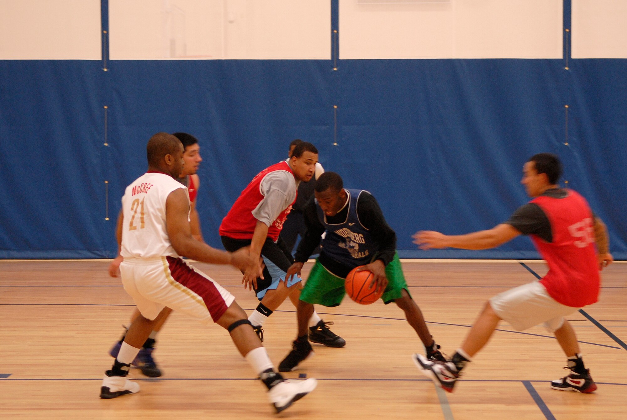 VANDENBERG AIR FORCE BASE, Calif. -- Surrounded by opponents, Anthoney Kilgore, a 30th Launch Group team member, attempts to break away from defenders at the Vandenberg Fitness Center here Monday, March 1, 2010.  The 30th LCG took the game, winning 64-60.  (U.S. Air Force photo/Senior Airman Andrew Satran) 

 
 