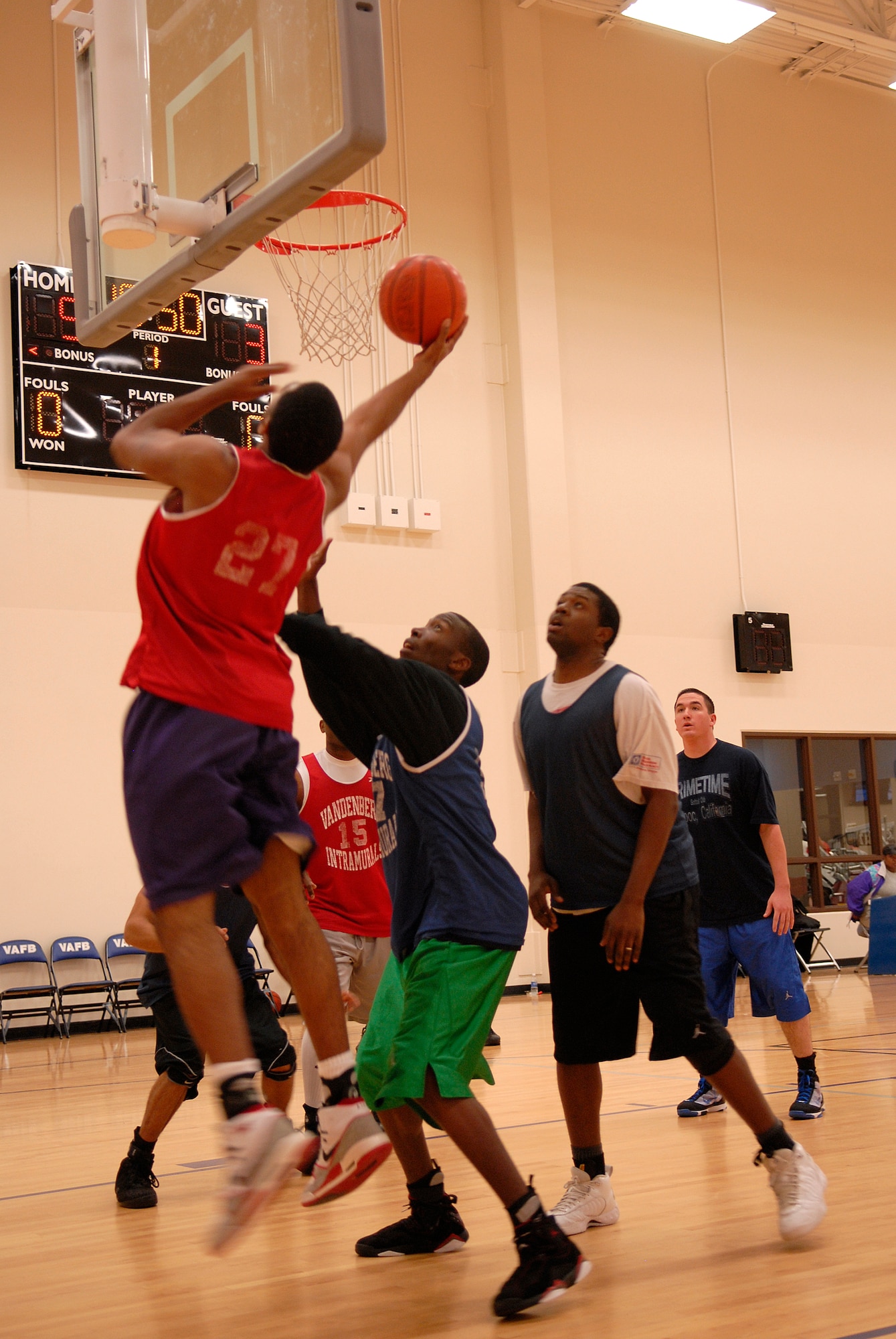 VANDENBERG AIR FORCE BASE, Calif. -- A 30th Medical Group team member, Joel Smith, breaks through the defense for a layup at the Vandenberg Fitness Center here Monday, March 1, 2010.  The 30th Launch Group took the game, winning 64-60.  (U.S. Air Force photo/Senior Airman Andrew Satran) 

 