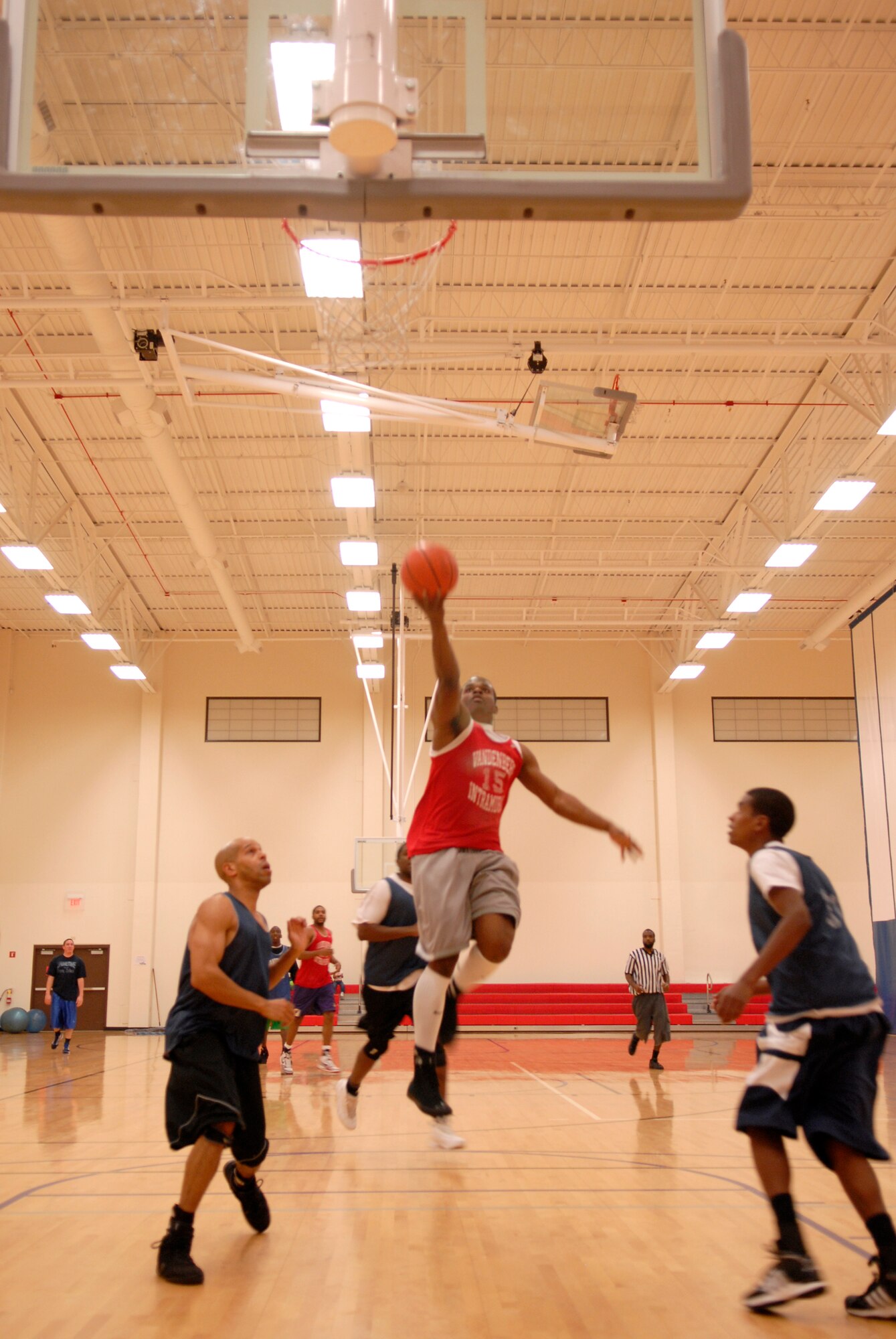 VANDENBERG AIR FORCE BASE, Calif. -- Jack Barnes, a 30th Medical Group team member, leaps for a layup at the Vandenberg Fitness Center here Monday, March 1, 2010.  The 30th Launch Group took the game, winning 64-60.  (U.S. Air Force photo/Senior Airman Andrew Satran) 

 