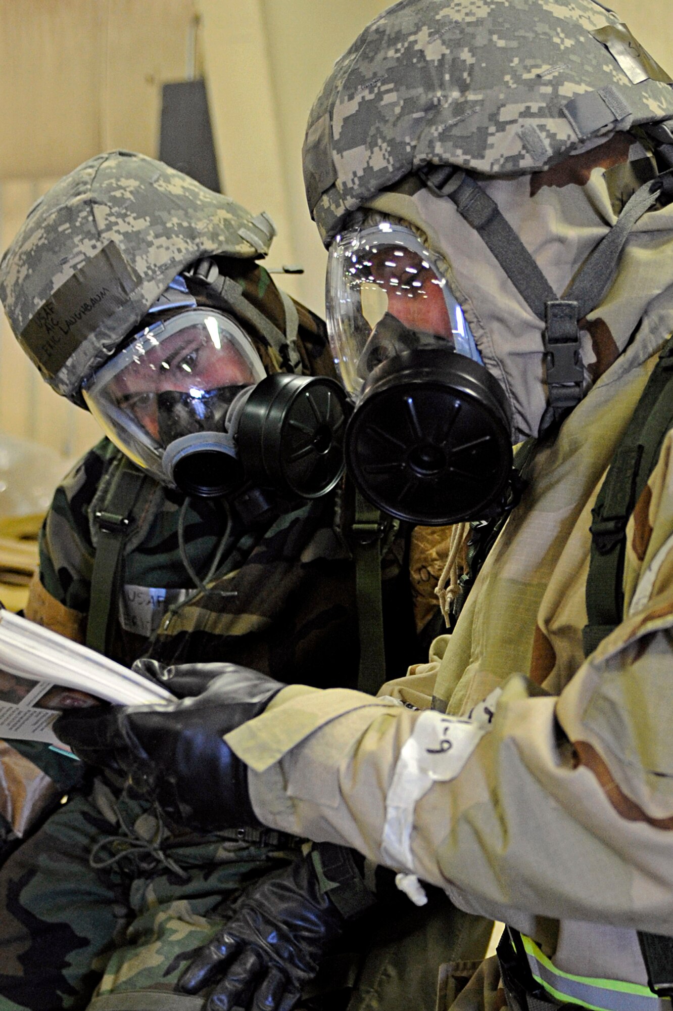 ELLSWORTH AIR FORCE BASE, S.D. -- (Right) Tech. Sgt. Don Hirst, 28th Logistics Readiness Squadron lightweight vehicle assistant NCO-in charge, and Airman 1st Class Eric Laughbaum, 28 LRS vehicle maintenance technician, review an Airman's Manual during a Phase II Operational Readiness Exercise, March 2. Operational Readiness Exercises provided training and prepared Airmen for worldwide deployments. (U.S. Air Force photo/Airman 1st Class Matthew Flynn)
