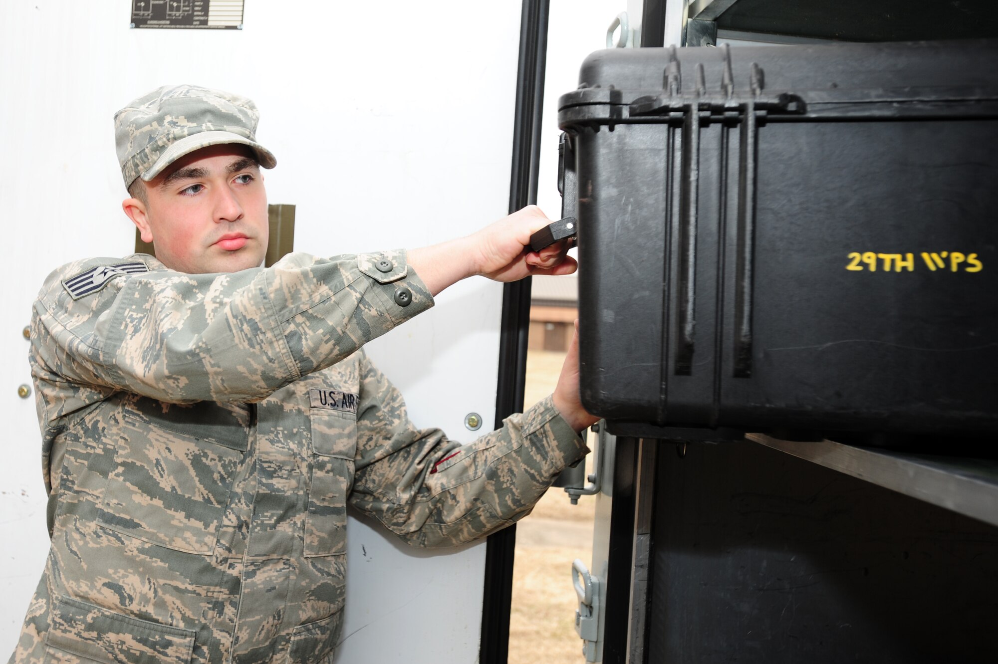 Staff Sgt. Bruce Wright, a 29th Weapons Squadron knowledge operations manager, prepares to check a deployment kit March 2. Sergeant Wright is vital to the 29th WPS where he’s a physical training leader and recently established top secret video conferencing capability, saving the squadron more than $2,000 annually. (U.S. Air Force photo by Senior Airman Steele C. G. Britton)