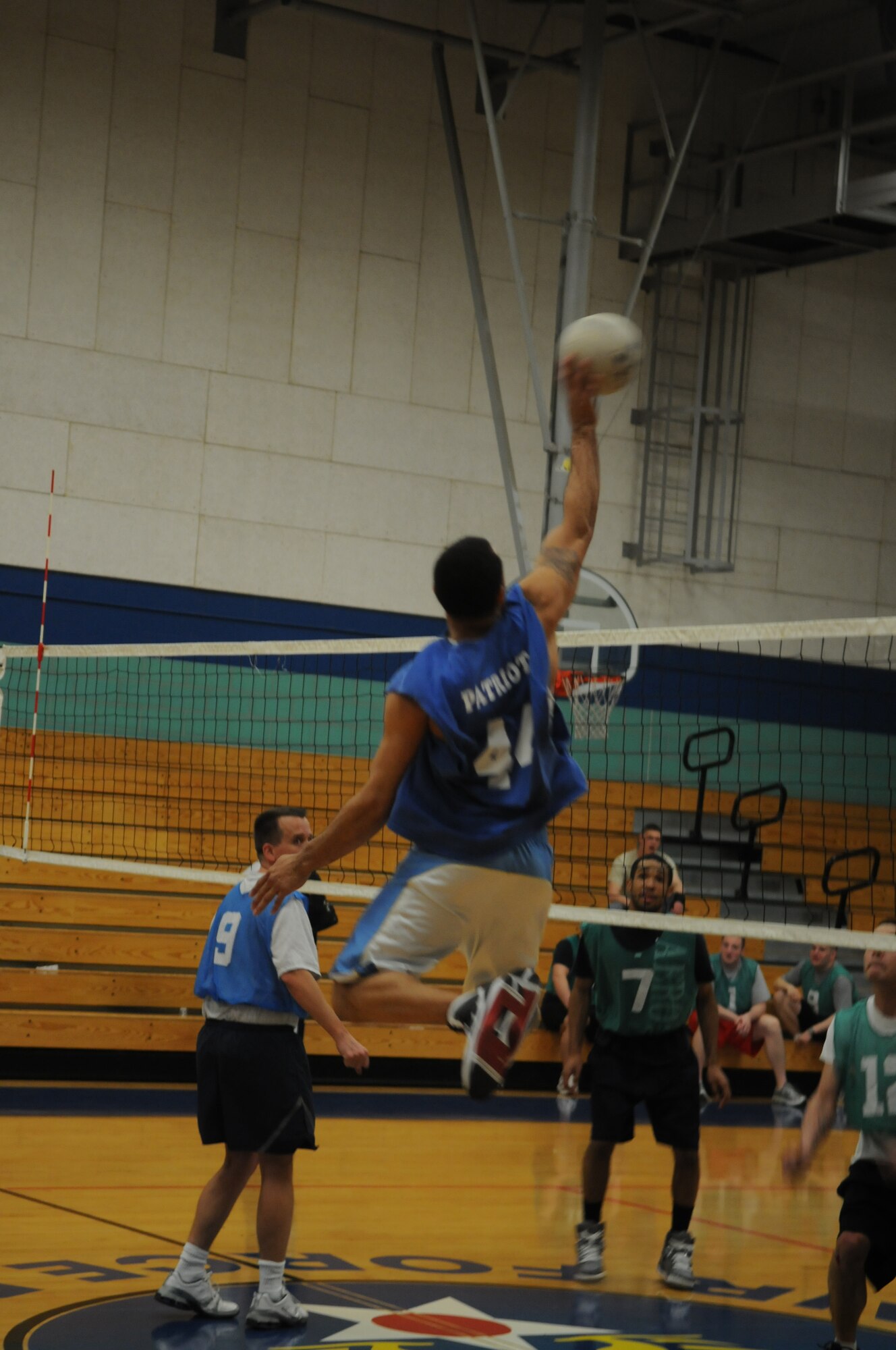 GOODFELLOW AIR FORCE BASE, Texas -- Tech. Sgt. Tim Harris, 316th Training Squadron, smacks the ball over the net in a volleyball match, Feb. 25, 2010. The 316th Sharks won their set against the 344th Military Intelligence Battalion. (U.S. Air Force photo/Airman 1st Class Clayton Lenhardt)