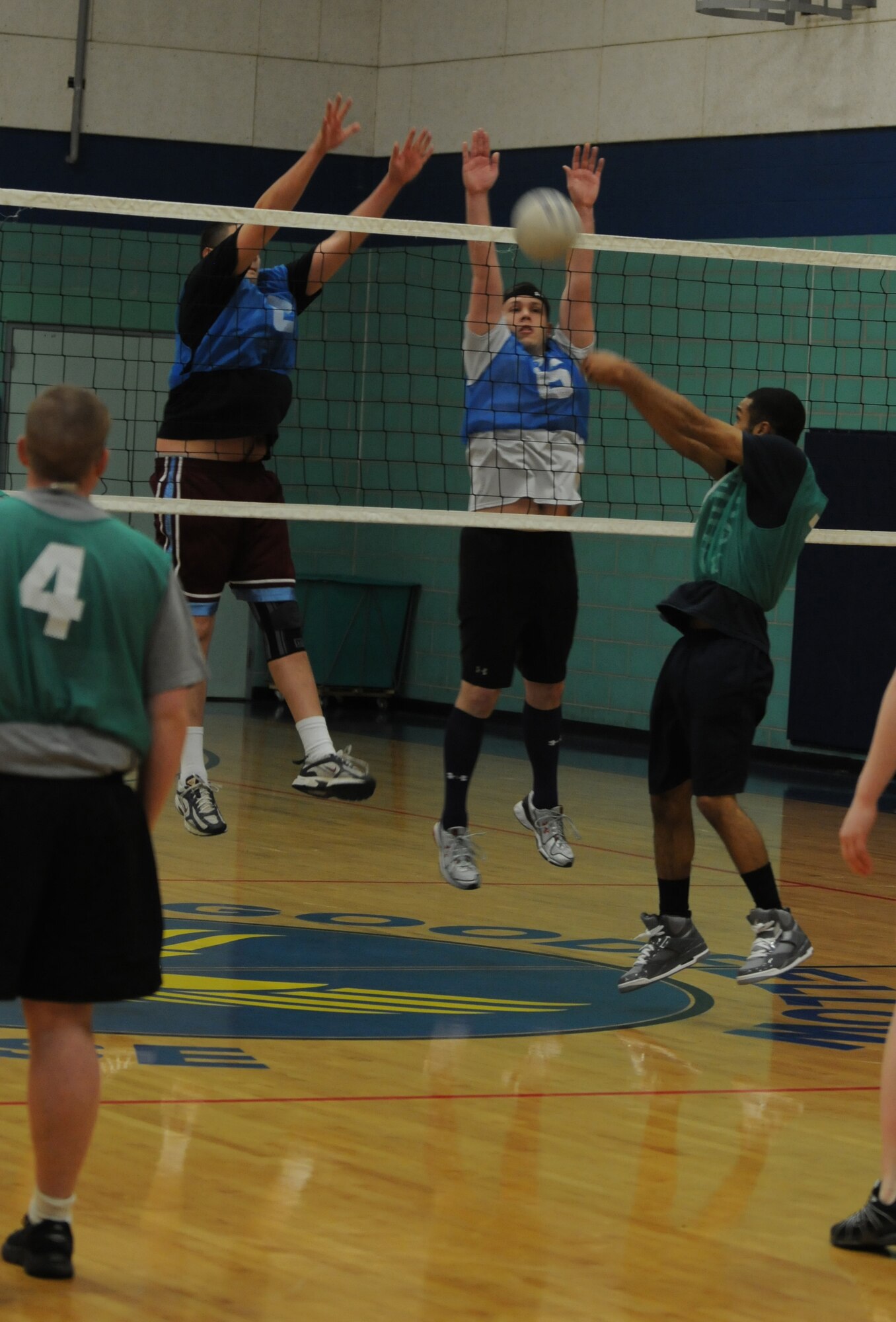GOODFELLOW AIR FORCE BASE, Texas -- The 344th Military Intelligence Battalion return the ball as the 316th Training Squadron Sharks attempt to block. The 316th Sharks won their set against the Army, Feb. 25, 2010. (U.S. Air Force photo/Airman 1st Class Clayton Lenhardt)