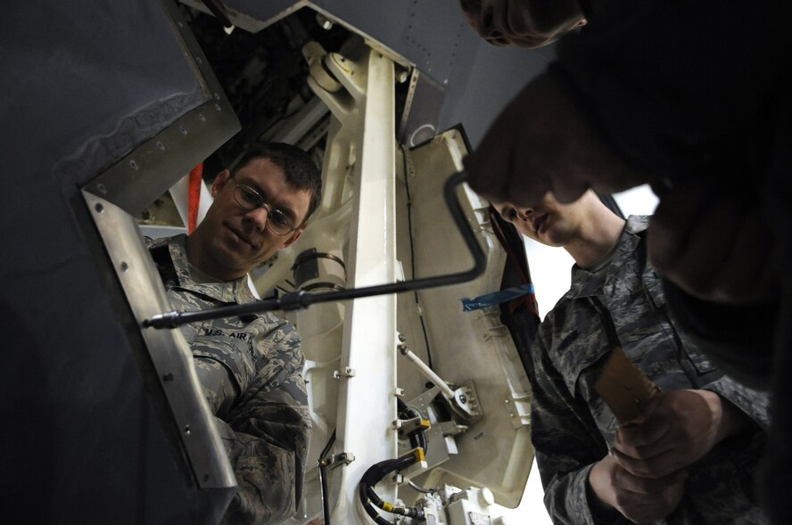 WHITEMAN AIR FORCE BASE, Mo. - Senior Airmen Tony Todaro (left) and Jason Owens, 509th Maintenance Squadron Aero Repair Shop technicians, replace a blade seal on the nose landing gear door of a B-2 Spirit Feb. 26, 2010. AR shop technicians perform a variety of unscheduled maintenance on B-2s daily. (U.S. Air Force photo/Senior Airman Jessica Snow)