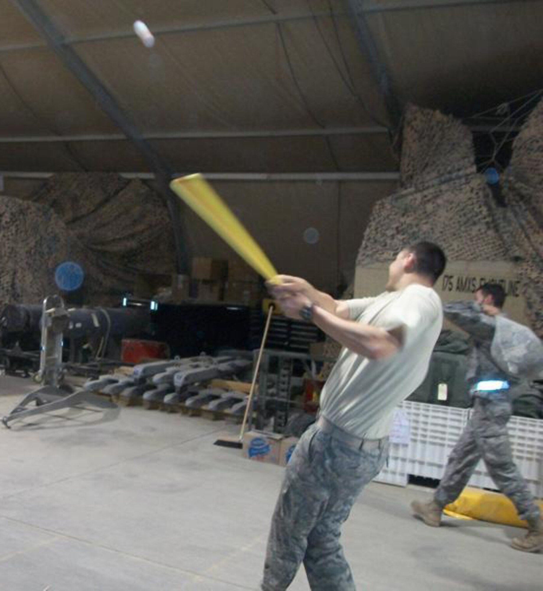 Members of the 188th Fighter Wing, based in Fort Smith, Ark., and the 175th Fighter Wing, based in Baltimore, Md., play Wiffle ball at Kandahar Airfield in Afghanistan Feb. 27, 2010, during off-duty hours. The sports items were delivered to the base to help boost morale. Sarah Butler-Thorne raised more than $2,000 to help purchase the products. Butler-Thorne is the wife of Tech. Sgt. Shawn Thorne, a crew chief with the 188th. The 188th deployed 50 members to Kandahar Jan. 4 as part of an Aerospace Expeditionary Force rotation. The 188th will deploy approximately 250 additional Guardsmen in early March, when the unit's official rotation begins. (Photo by Tech. Sgt. Shawn Thorne/188th Fighter Wing)