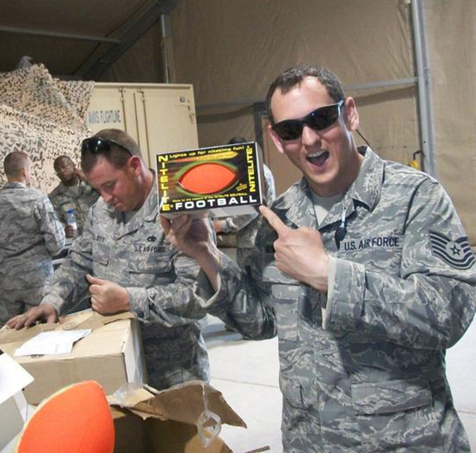 Members of the 188th Fighter Wing, based in Fort Smith, Ark., and the 175th Fighter Wing, based in Baltimore, Md., open care packages at Kandahar Airfield in Afghanistan Feb. 27, 2010. The boxes were filled with recreational items provided by Sarah Butler-Thorne, who raised more than $2,000 to help purchase the products. Butler-Thorne is the wife of Tech. Sgt. Shawn Thorne, a crew chief with the 188th. The 188th deployed 50 members to Kandahar Jan. 4 as part of an Aerospace Expeditionary Force rotation. The 188th will deploy approximately 250 additional Guardsmen in early March, when the unit's official rotation begins. (Photo by Tech. Sgt. Shawn Thorne/188th Fighter Wing)