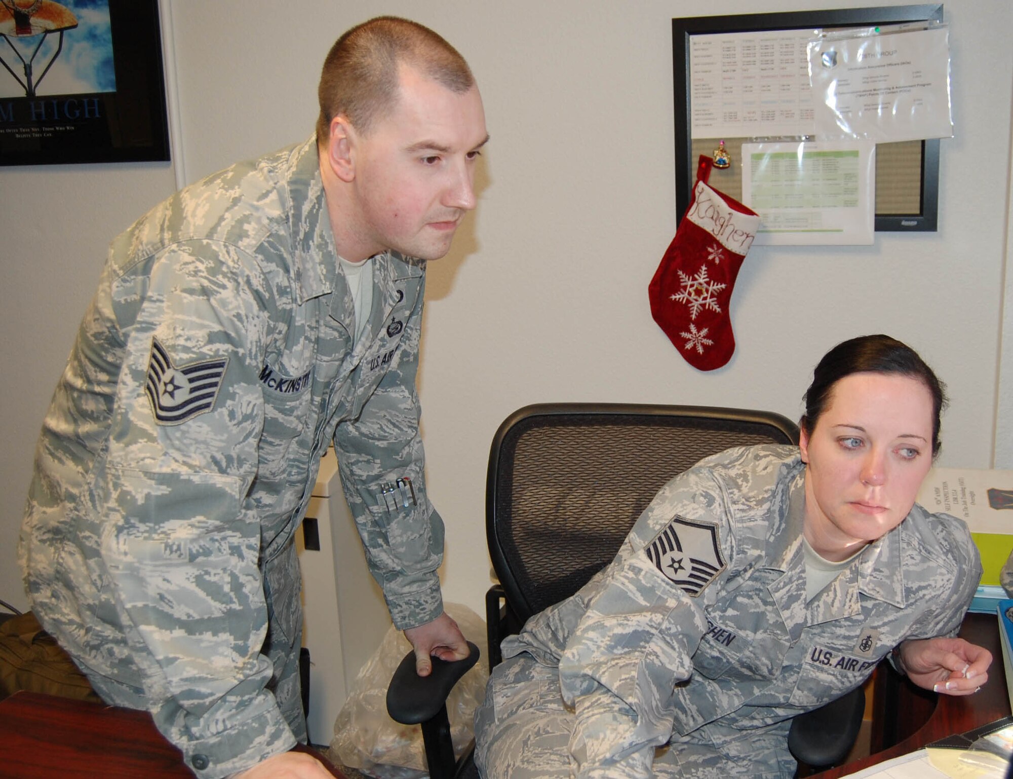 Tech. Sgt. McKinstry, 926th Group Education and Training Manager (left), inspects Master Sgt. Kaighen's training programs during a base Staff Assistance Visit of the 926th Aerospace Medicine Flight.

Sergeant McKinstry was recognized as the Education and Training Non-commissioned Officer of the Year at the Air Force Reserve Command level on Feb. 22. He had previously won the same award at the 10th Air Force level.