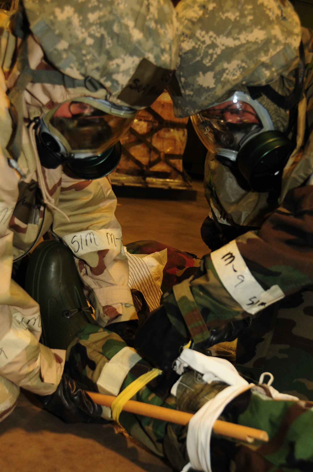 ELLSWORTH AIR FORCE BASE, S.D. -- (Left to right) Senior Airmen Ludmilla Alvarado, 28th Logistics Readiness Squadron supply systems specialist and Anje Hall, 28 LRS customer service representative, splint a simulated compound fracture during a Phase II Operational Readiness Exercise, March 2.  The Phase II ORE is designed to simulate a deployed environment and test the combat abilities, such as self-aid and buddy care, of Ellsworth's Airmen. (U.S. Air Force photo/Airman 1st Class Anthony Sanchelli)
