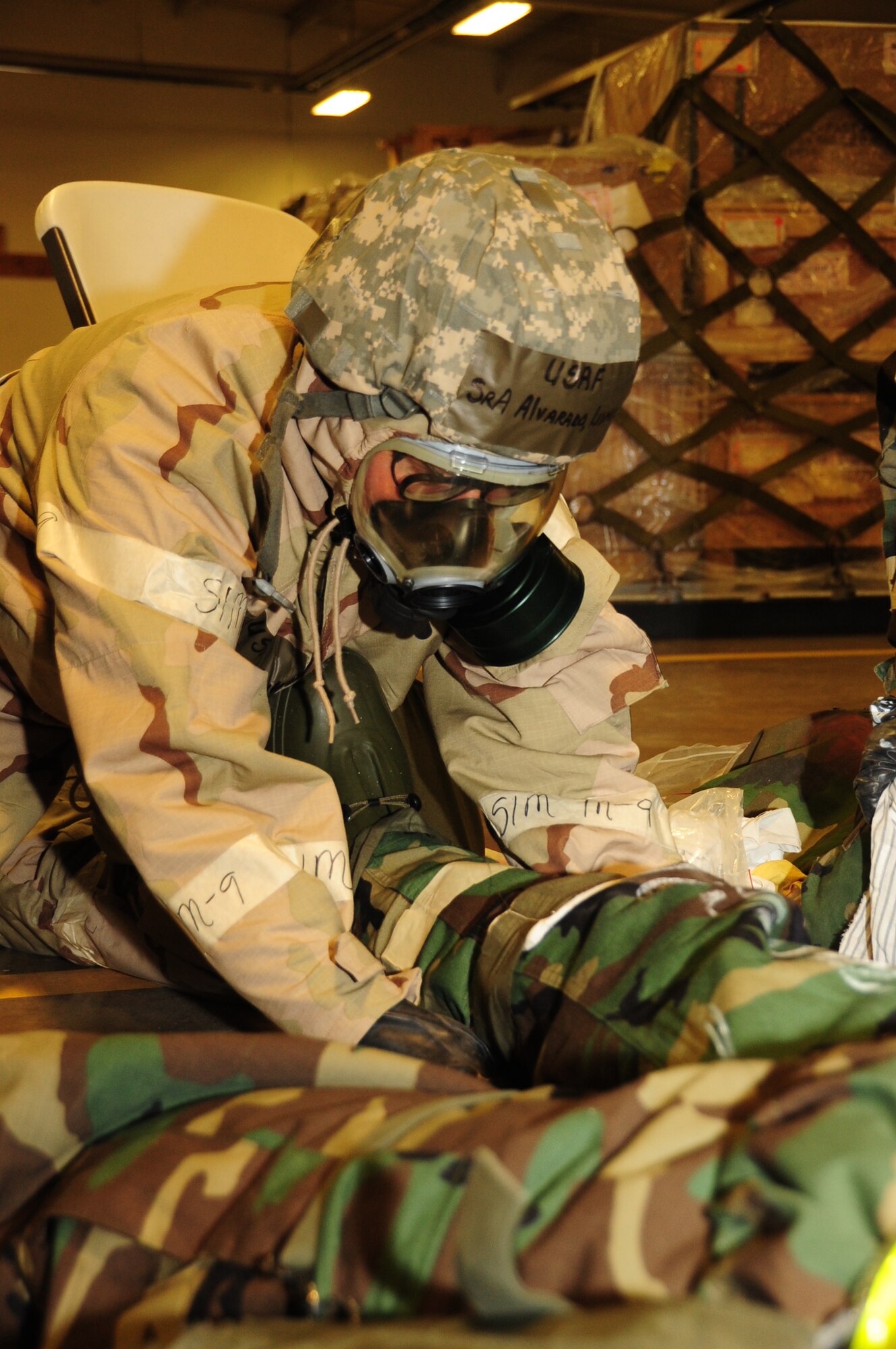 ELLSWORTH AIR FORCE BASE, S.D. -- Senior Airman Ludmilla Alvarado, 28th Logistics Readiness Squadron supply systems specialist, begins bandaging a simulated compound fracture during a Phase II Operational Readiness Exercise, March 2.  The Phase II ORE is designed to simulate a deployed environment and test the combat abilities, such as self-aid and buddy care, of Ellsworth's Airmen. (U.S. Air Force photo/Airman 1st Class Anthony Sanchelli)
