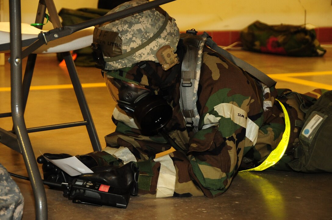 ELLSWORTH AIR FORCE BASE, S.D. -- Master Sgt. William Little, 28th Logistics Readiness Squadron NCO in charge of compliance and analysis, reads over an exercise inject during a Phase II Operational Readiness Exercise, March 2.  The Phase II ORE is designed to simulate a deployed environment and test the combat abilities of Ellsworth's Airmen. (U.S. Air Force photo/Airman 1st Class Anthony Sanchelli)