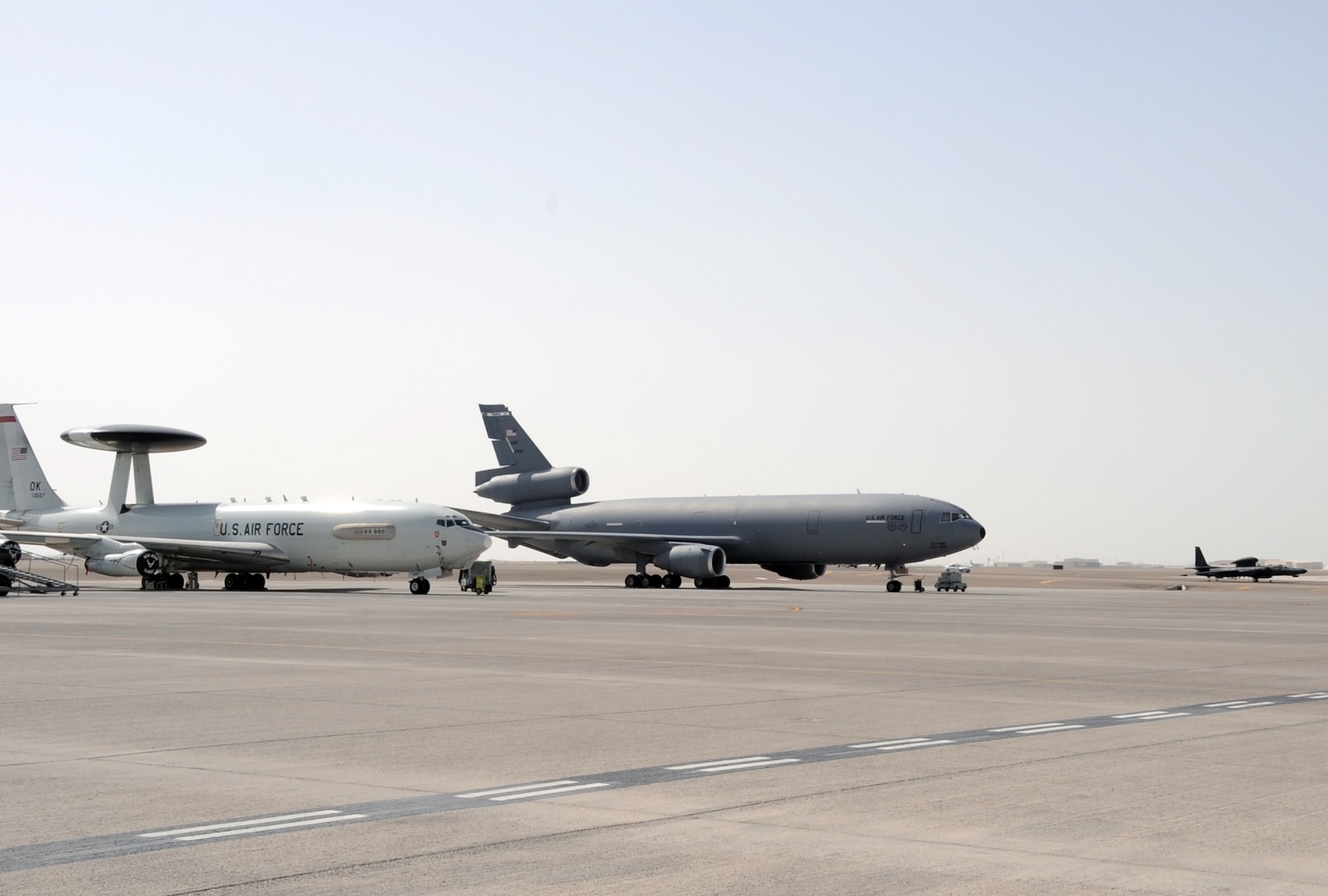 A U-2 Dragonlady assigned with the 99th Expeditionary Reconnaissance Squadron taxis down the runway in view of a KC-10 Extender assigned to the 908th Expeditionary Air Refueling Squadron, and an E-3 Sentry assigned to the 965th Expeditionary Airborne Air Control Squadron during operations at a non-disclosed base in Southwest Asia on Feb. 23, 2010. The 99th ERS, 908th EARS and 965th EAACS are a part of the 380th Air Expeditionary Wing which supports operations Iraqi Freedom and Enduring Freedom and the Combined Joint Task Force-Horn of Africa. (U.S. Air Force Photo/Master Sgt. Scott T. Sturkol/Released)