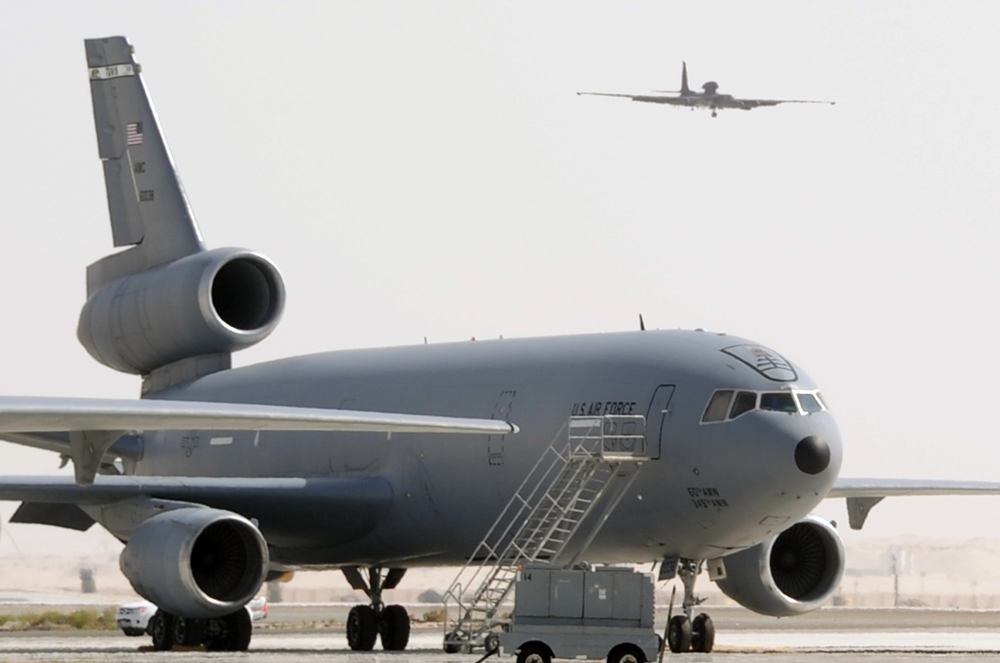 A U-2 Dragonlady assigned with the 99th Expeditionary Reconnaissance Squadron comes in for landing in view of a KC-10 Extender from the 908th Air Refueling Squadron during operations at a non-disclosed base in Southwest Asia on Feb. 23, 2010. Both the 99th ERS and the 908th EARS are part of the 380th Air Expeditionary Wing which supports operations Iraqi Freedom and Enduring Freedom and the Combined Joint Task Force-Horn of Africa. (U.S. Air Force Photo/Master Sgt. Scott T. Sturkol/Released)