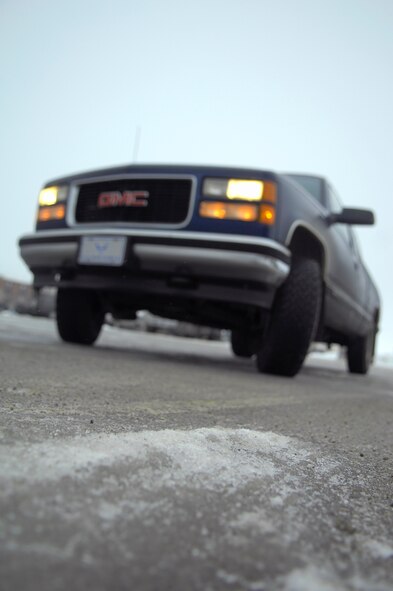 MINOT AIR FORCE BASE, N.D. -- Black ice can appear to be a spot of moisture on a road or may have a slight glisten on black asphalt. However, this thin ice is very slick and your car can skid easily on it. Minot Airmen are encouraged to keep safety in mind when driving on North Dakota’s slick spring roads. (U.S. Air Force photo by Senior Airman Benjamin Stratton)