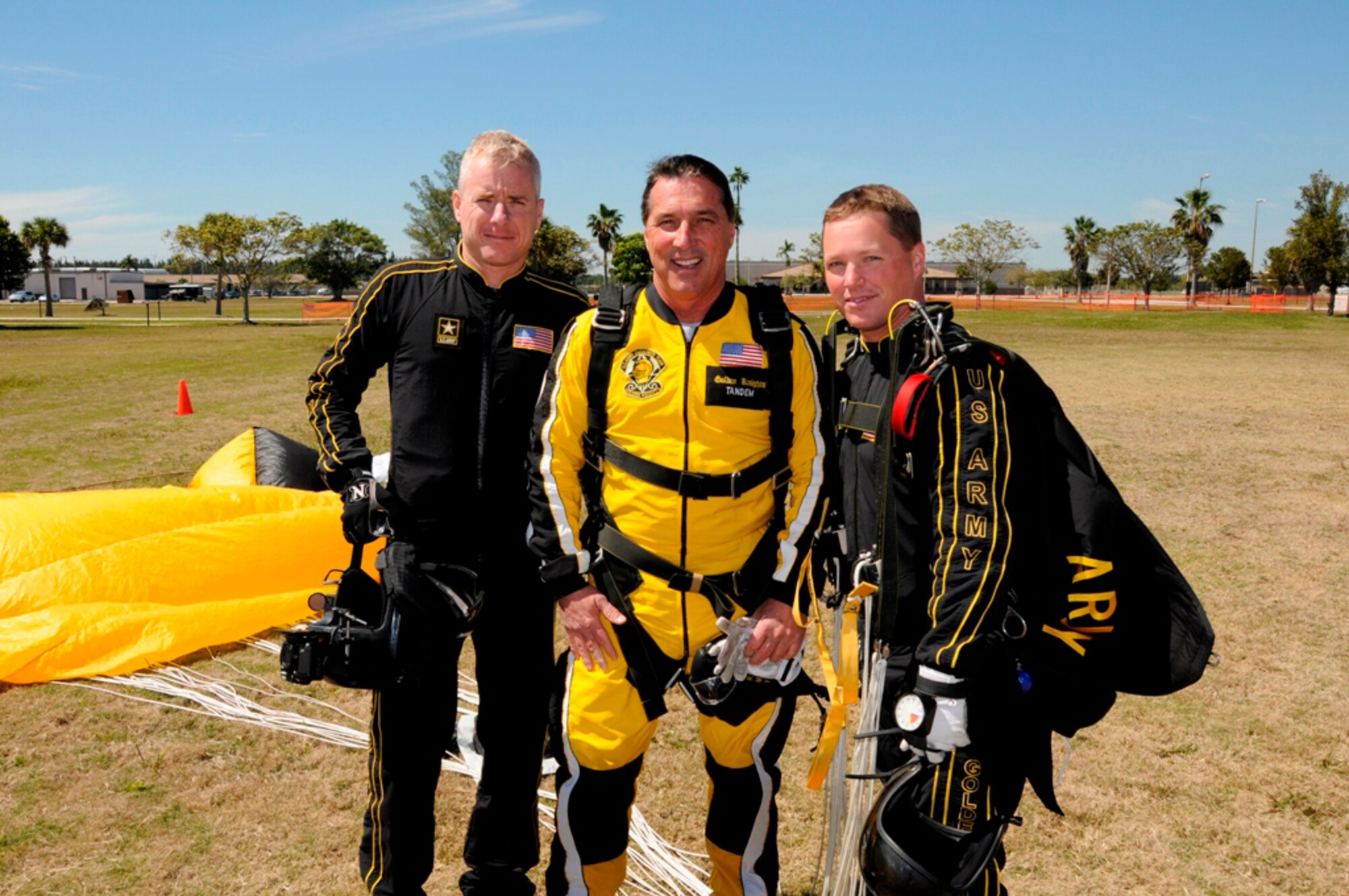 City of Homestead Mayor Steve Bateman is flanked by U.S. Army Golden Knights, Sgt. 1st Class Eric Heinshiner, left, and Staff Sgt. Joe Johns after completing a 13,000 foot tandem parachute jump at Homestead Air Reserve Base Fla., on March 1. (U.S. Air Force photo/Tim Norton)