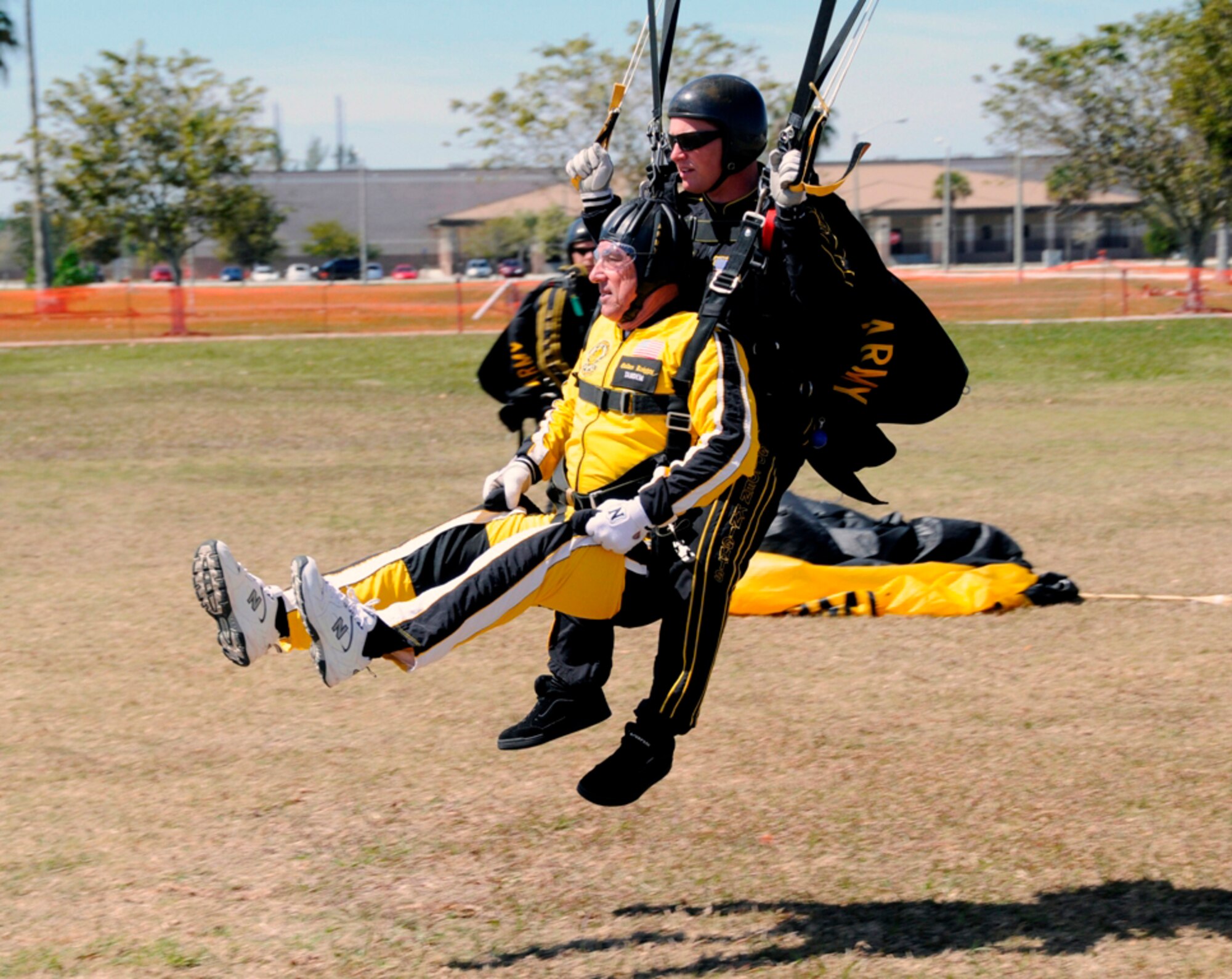 City of Homestead Mayor Steve Bateman prepares to land with U.S. Army Golden Knights member, Staff Sgt. Joe Johns after completing a 13,000 foot tandem parachute jump at Homestead Air Reserve Base, Fla., on March 1. (U.S. Air Force photo/Tim Norton)