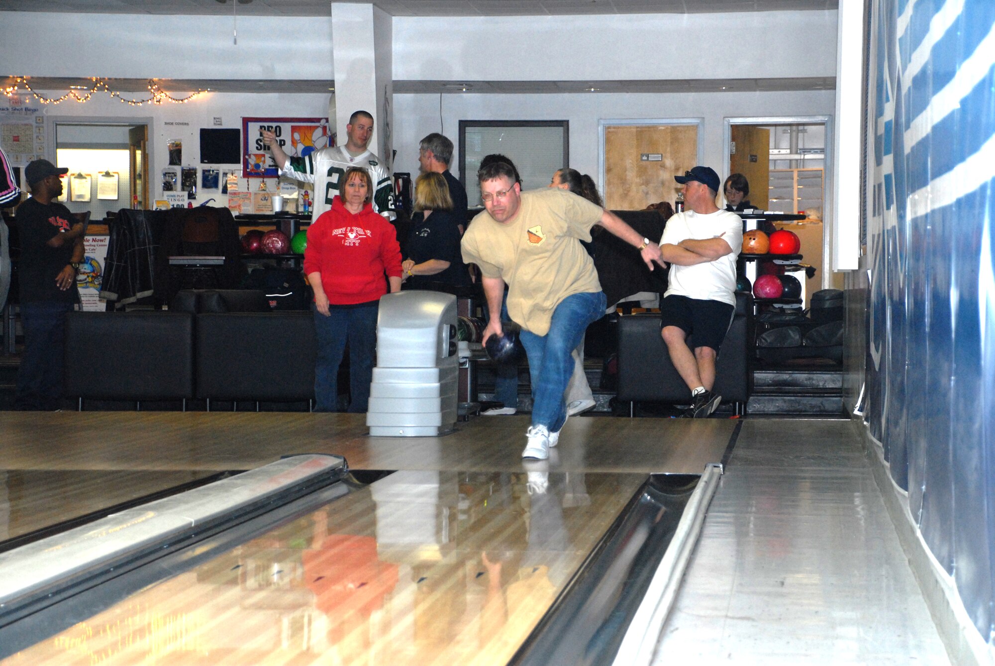Master Sgt. Harold 'Vic' Jeffries, 9th Airlift Squadron, bowls during league night at the Eagle Lanes Bowling Center Feb. 18 after receiving his commemorative ring for bowling a perfect score on Dec. 18, 2009. Sergeant Jeffries plays as part of a mixed league at the bowling center, which is held every Friday. (U.S. Air Force photo/ Airman 1st Class Matthew Hubby)