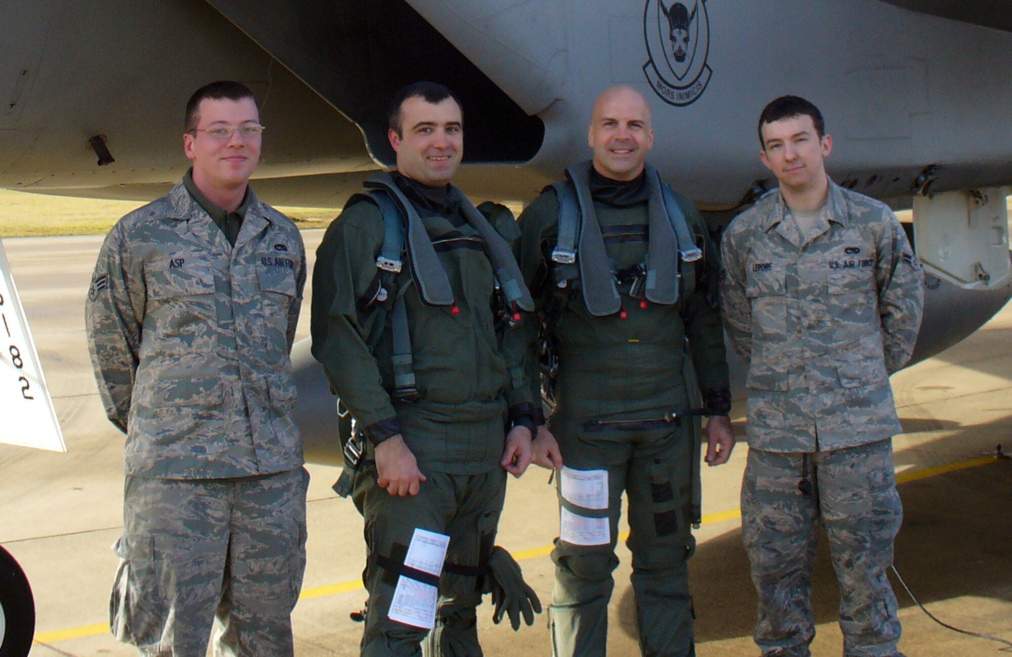 RAF LAKENHEATH, England -- Senior Airman Nils Asp, 748th Aircraft Maintenance Squadron avionics specialist, Maj. Mark Wolfe, 48th Operations Group Standards and Evaluations chief, Col. Chad Manske, 100th Air Refueling Wing commander and Airman 1st Class Vincent Lepore, 748th AMXS assistant dedicated crew chief, stand beside the F-15 Major Wolfe and Colonel Manske flew in March 1.  The colonel flew with the 48th Fighter Wing to see his wing's mission from another angle.  (U.S. Air Force photo/Capt. Mark Perry)